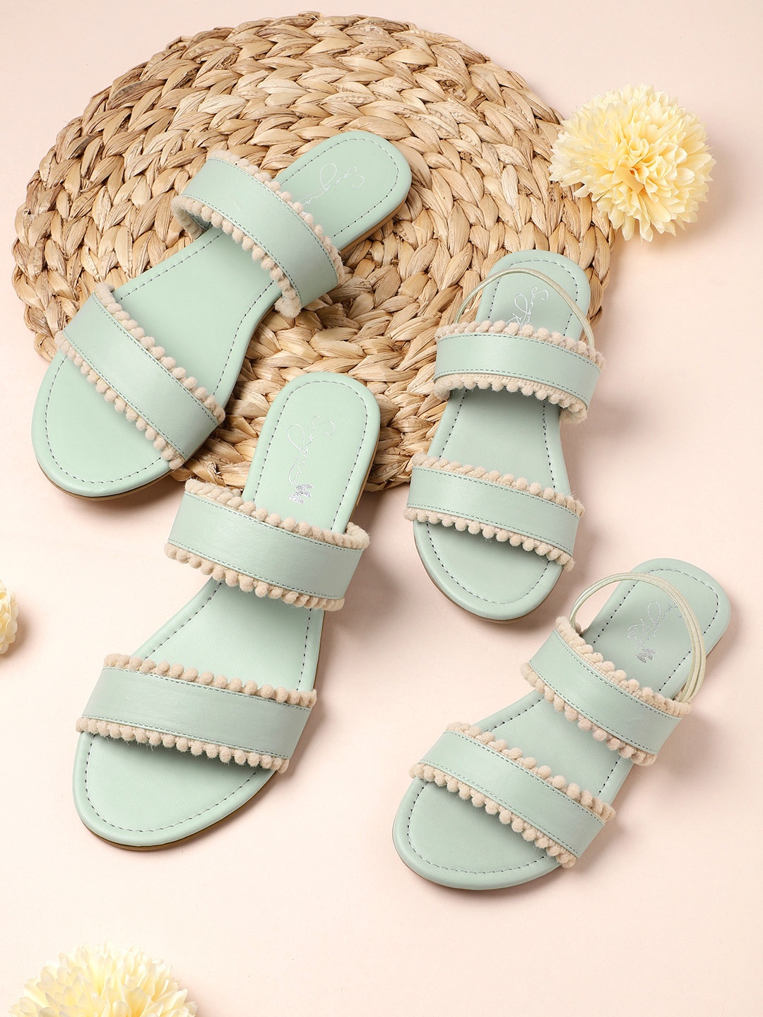 

Sangria Girls Mint Green & Off-White Solid Open Toe Flats with Pom Pom Detail
