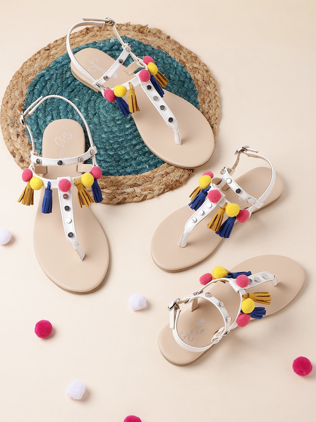 

Sangria Women White & Pink Pom-Pom T-Strap Flats with Tassels