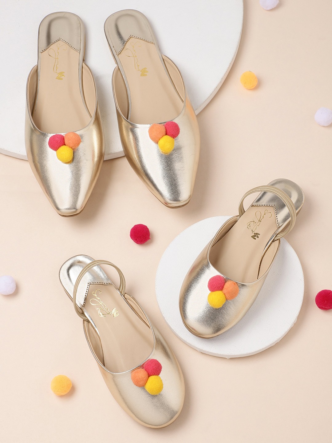 

Sangria Women Gold-Toned Solid Pom-Pom Detail Mules