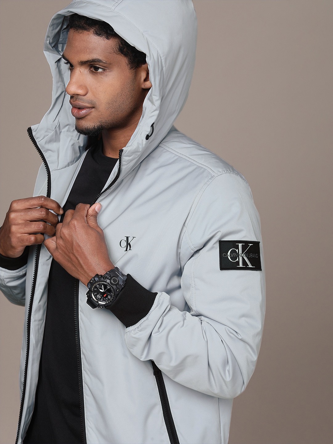 

Calvin Klein Jeans Men Grey Hooded Padded HARRINGTON Jacket With Logo Print