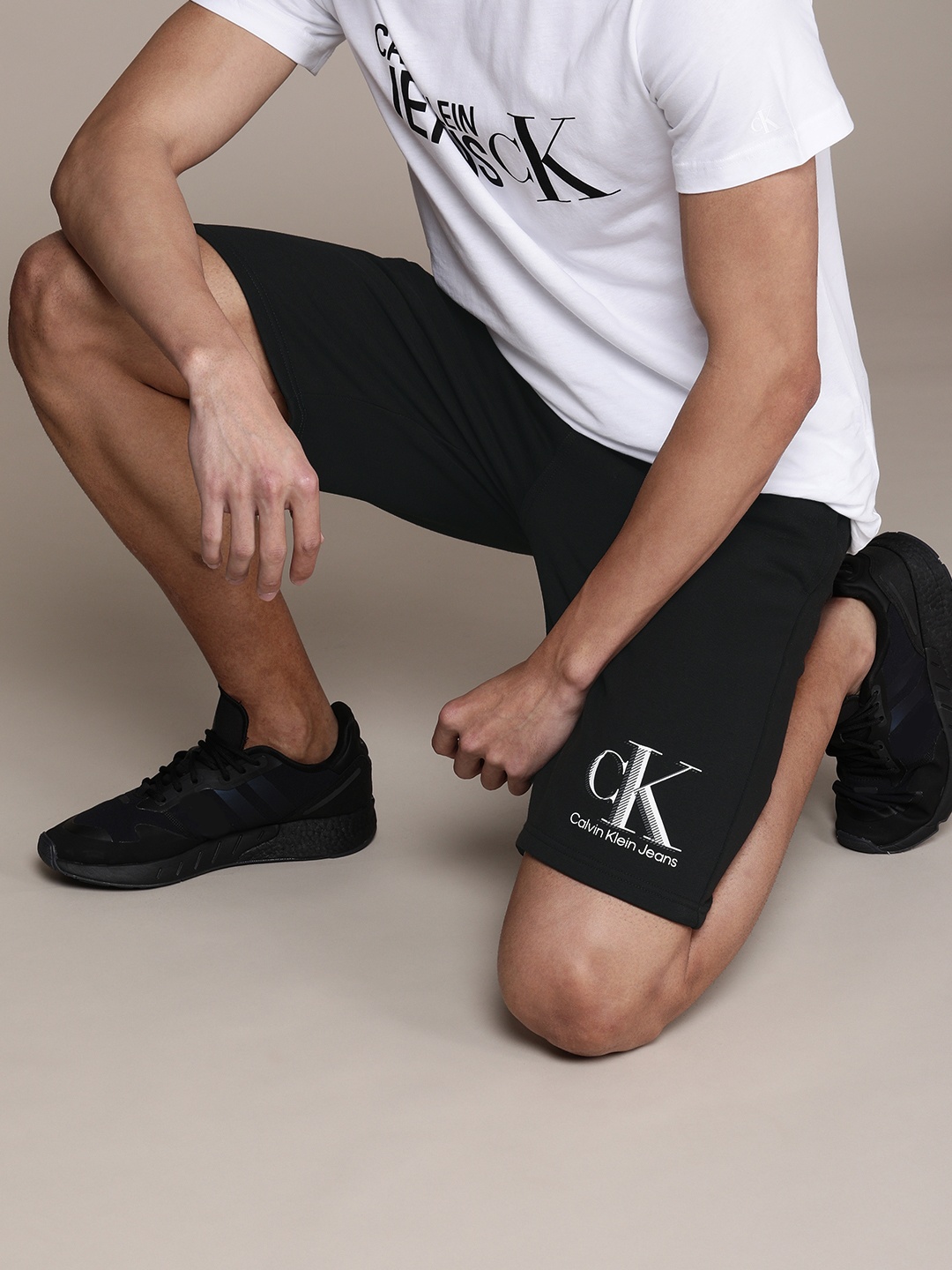 

Calvin Klein Jeans Men Black Typography Printed Regular Shorts