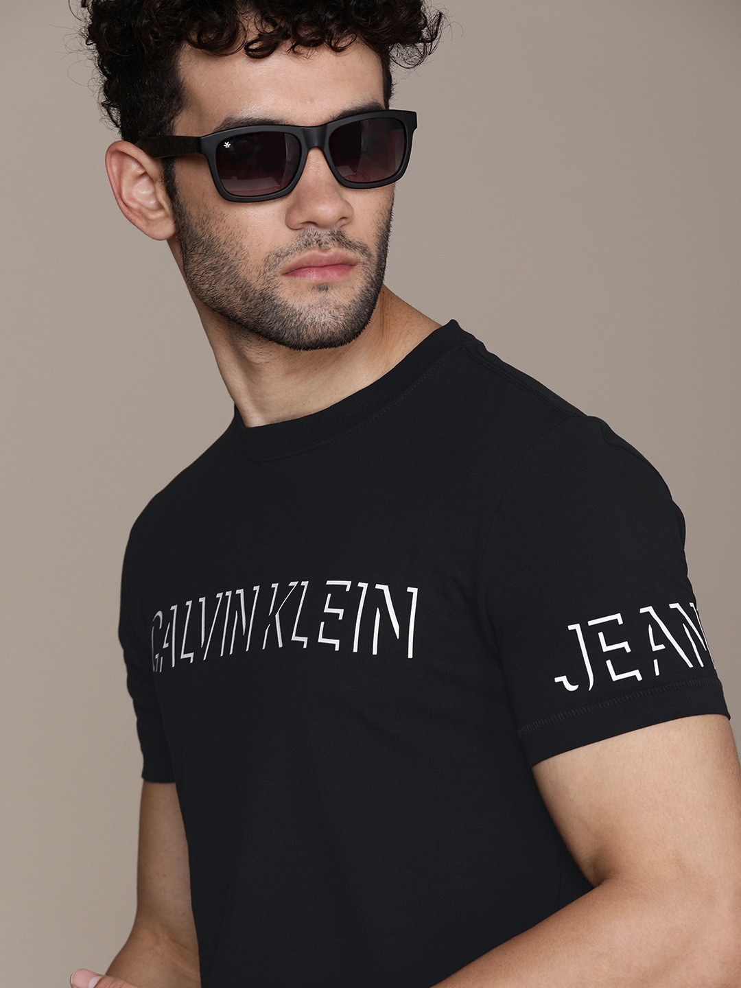 

Calvin Klein Jeans Men Black Logo Printed Regular Fit Casual T-shirt