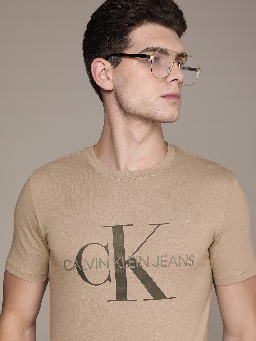

Calvin Klein Jeans Men Beige Brand Logo Printed Pure Cotton T-shirt