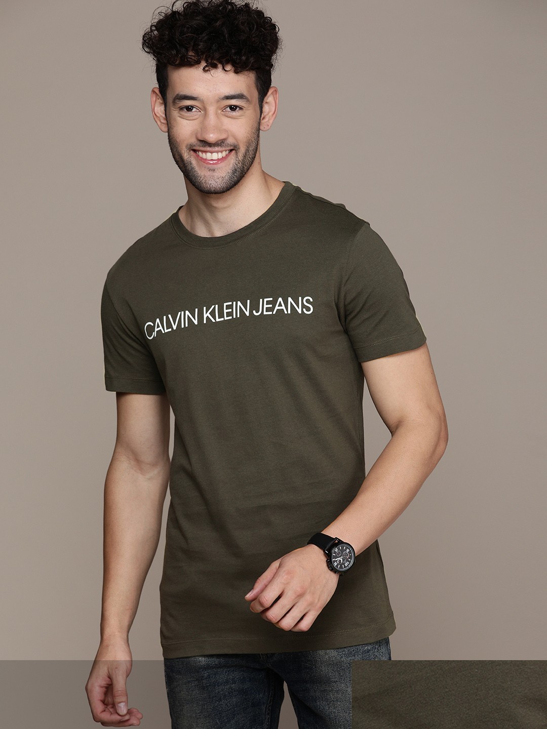 

Calvin Klein Jeans Men Olive Green Brand Logo Printed T-shirt