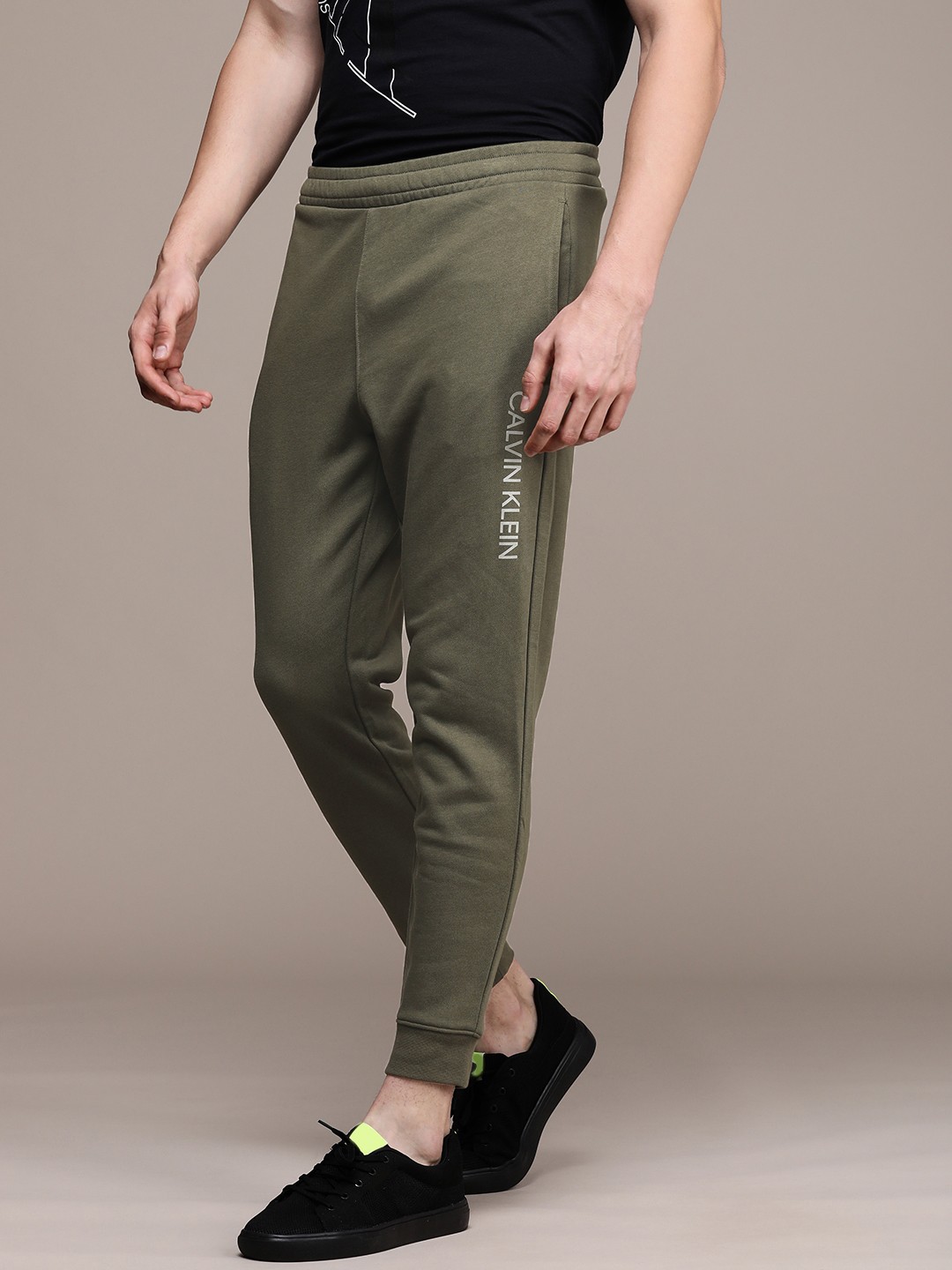 

Calvin Klein Jeans Men Olive Green Solid Joggers with Brand Logo Print Detail