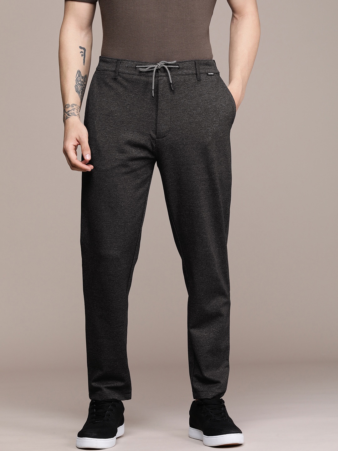 

Calvin Klein Jeans Men Black Self-Design Regular Trousers