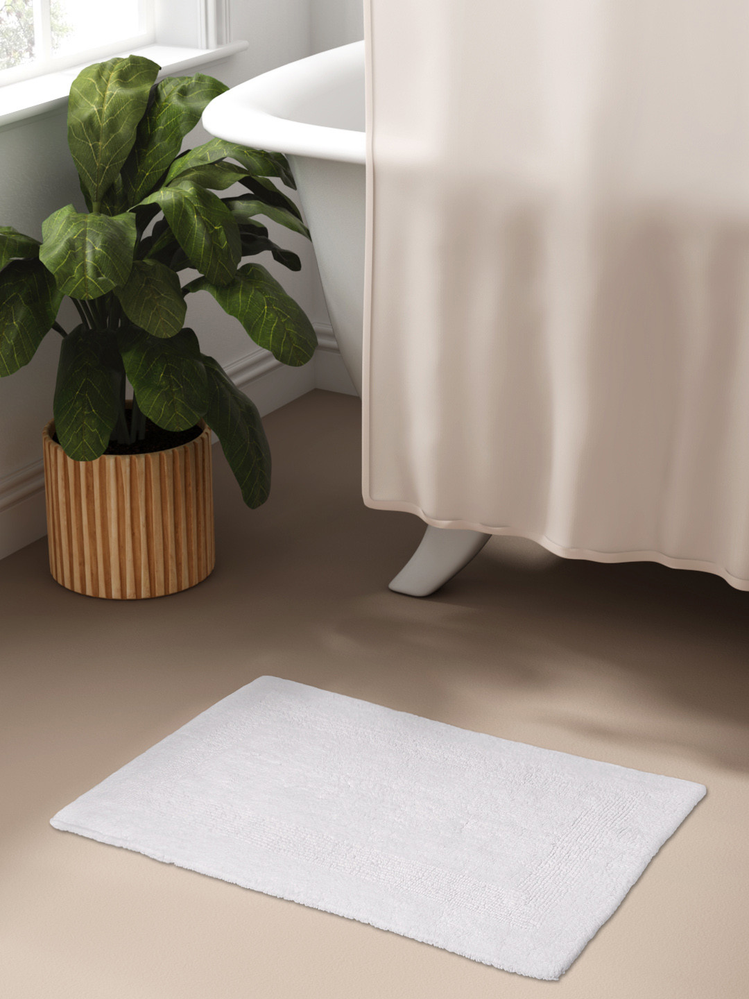 

Aura White Solid Cotton Bath Rug