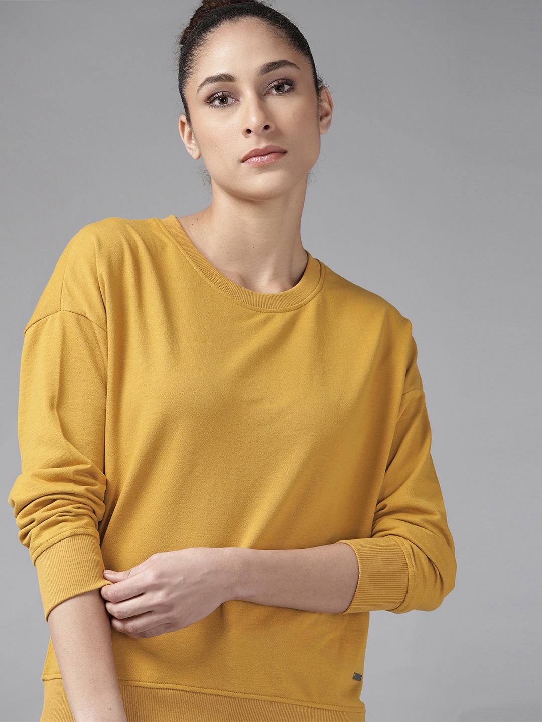 

Roadster Women Mustard Yellow Drop-Shoulder Sleeves Solid Sweatshirt