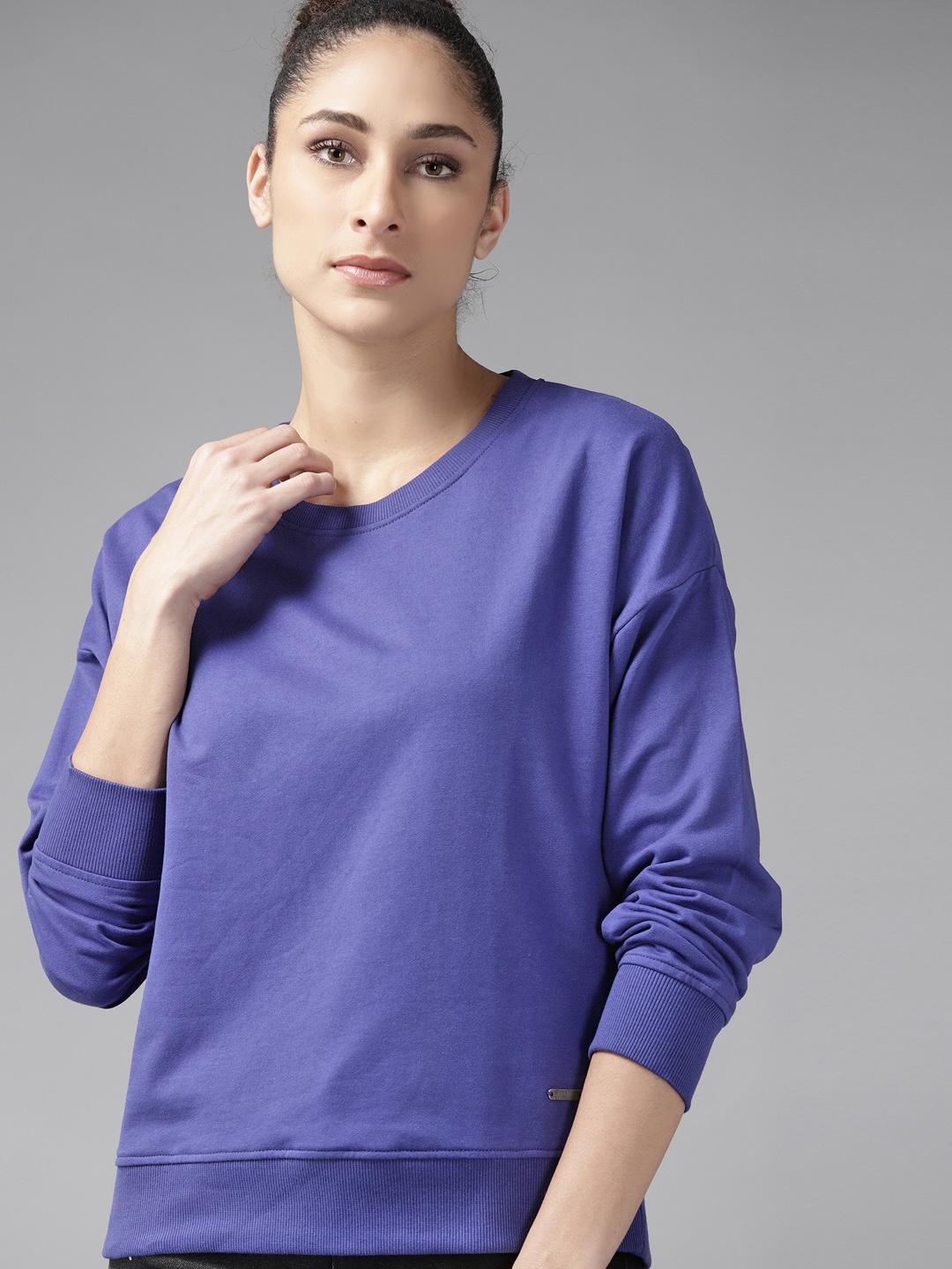 

Roadster Women Blue Drop-Shoulder Sleeves Solid Sweatshirt