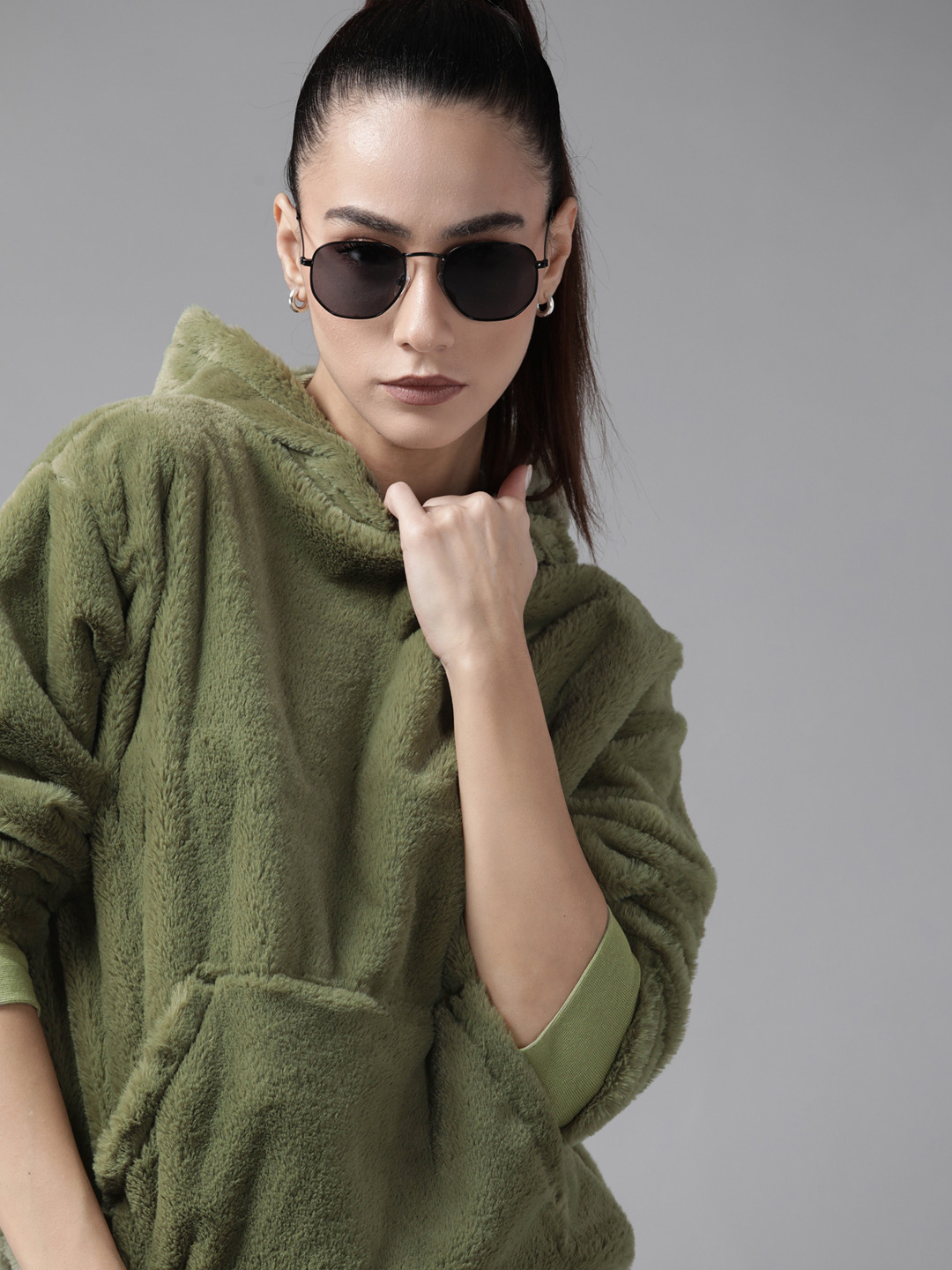 

Roadster Women Green Solid Hooded Sweatshirt