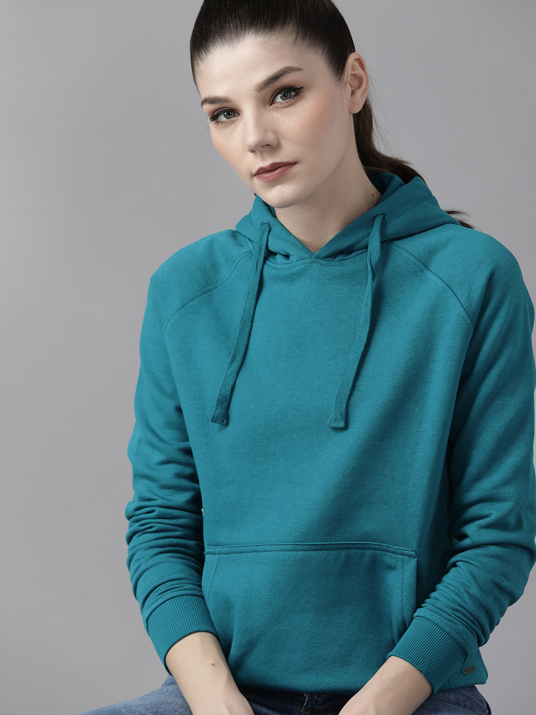 

Roadster Women Teal Blue Solid Hooded Sweatshirt
