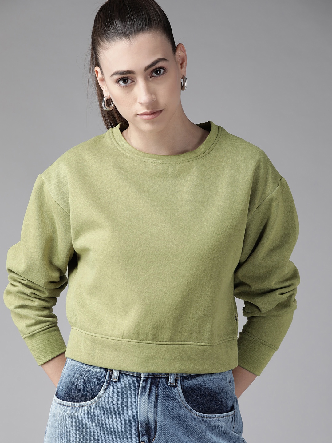 

Roadster Women Green Solid Sweatshirt