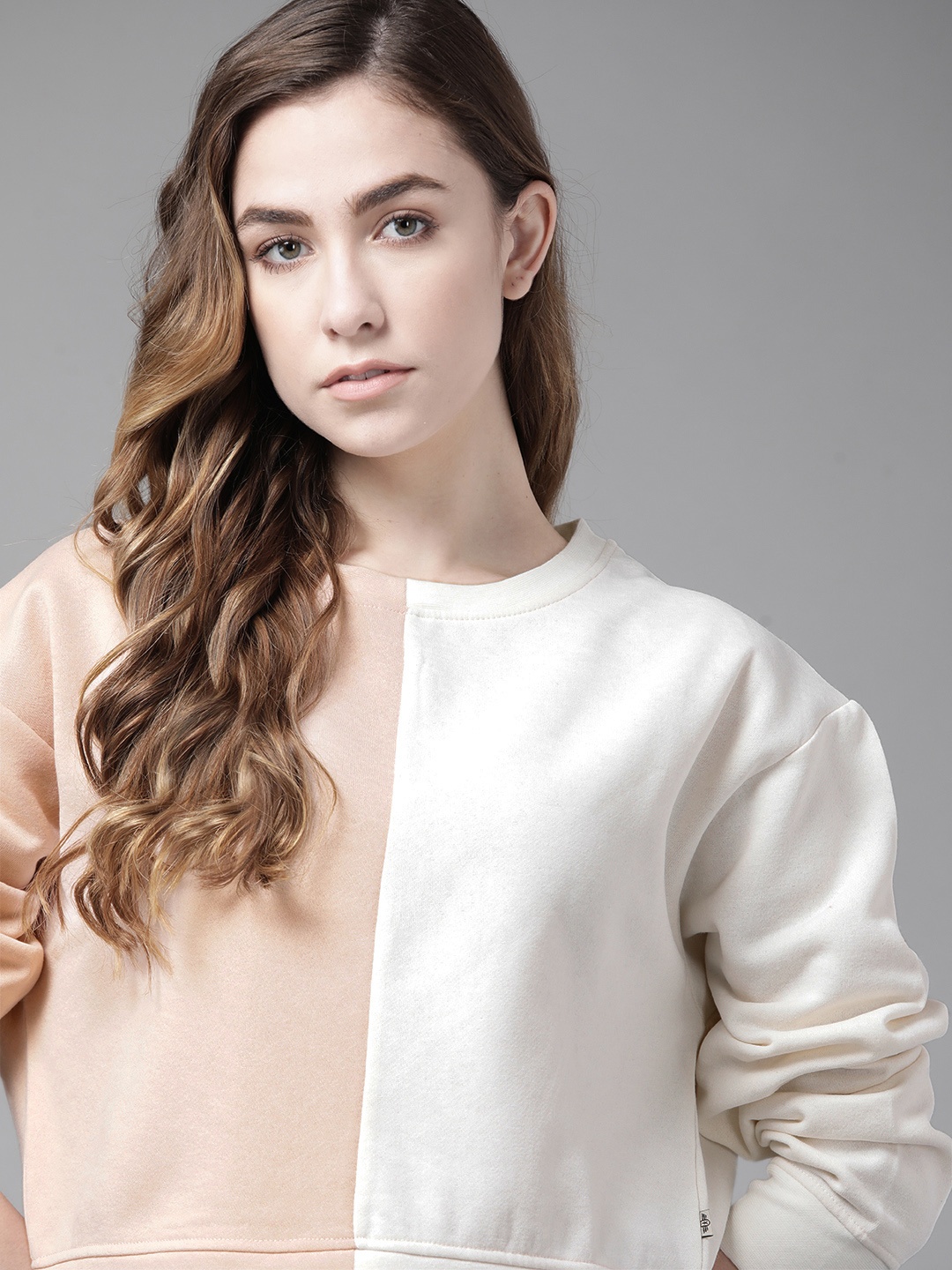 

Roadster Women Peach-Coloured & White Colourblocked Sweatshirt