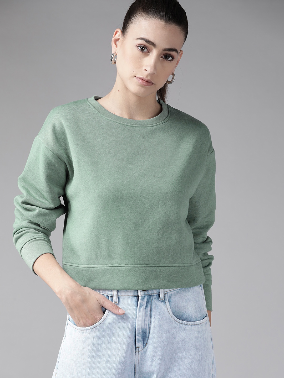 

Roadster Women Green Solid Sweatshirt