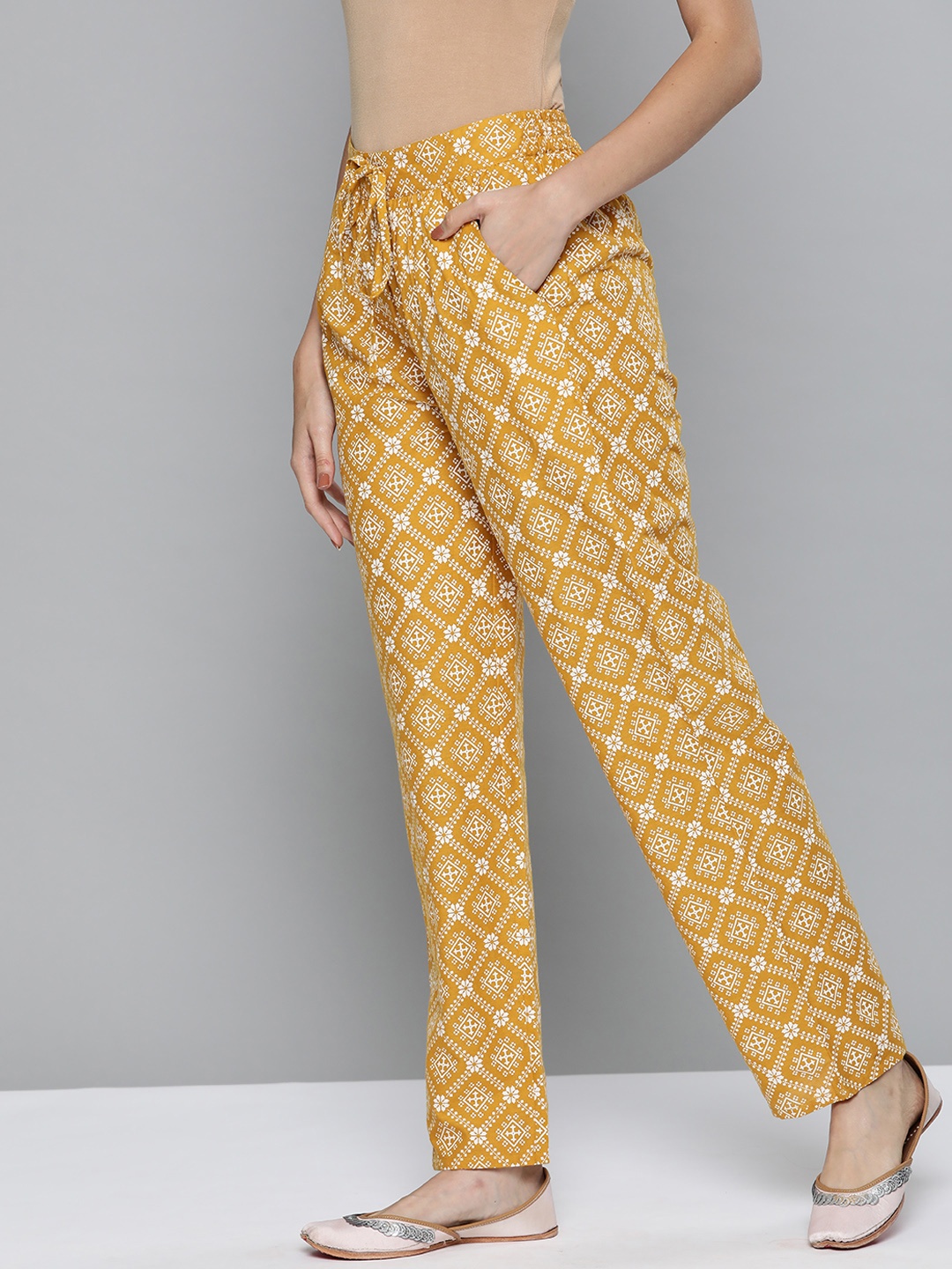 

HERE&NOW Women Mustard Yellow & White Ethnic Motifs Printed Pure Cotton Trousers