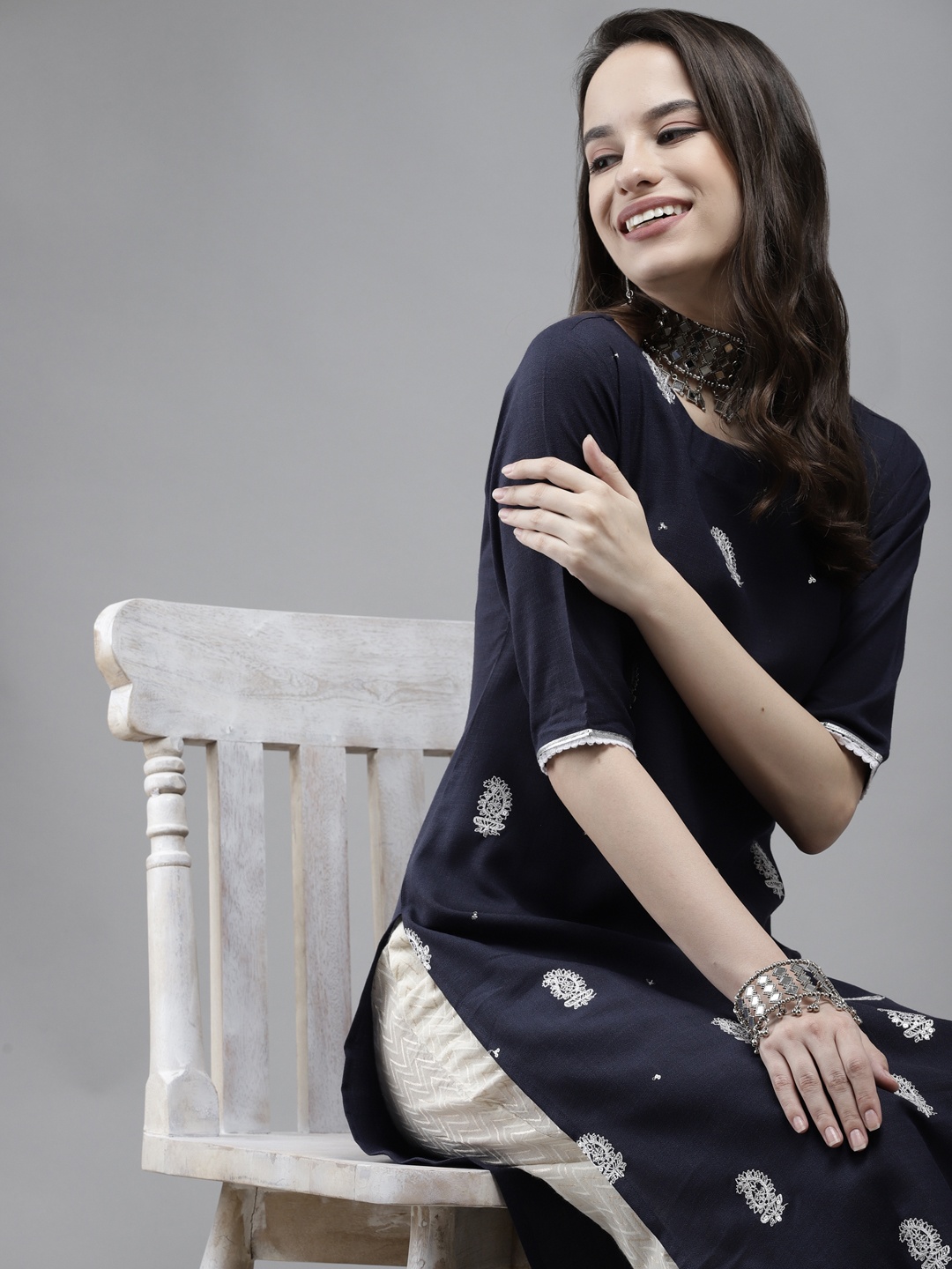 

Indo Era Women Navy Blue & White Paisley Embroidered Thread Work Kurta