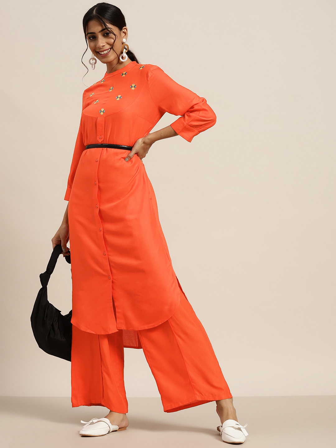 

Sangria Women Rust Orange Ethnic Yoke Design Thread Work Straight Kurta & Palazzos