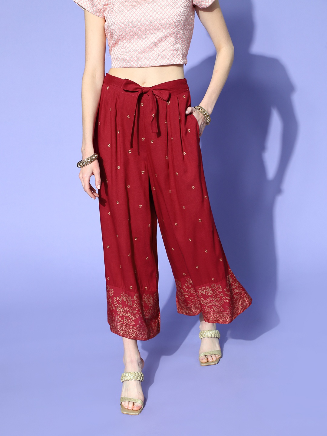 

Sangria Women Maroon & Golden Ethnic Motifs Printed Flared Ethnic Palazzos