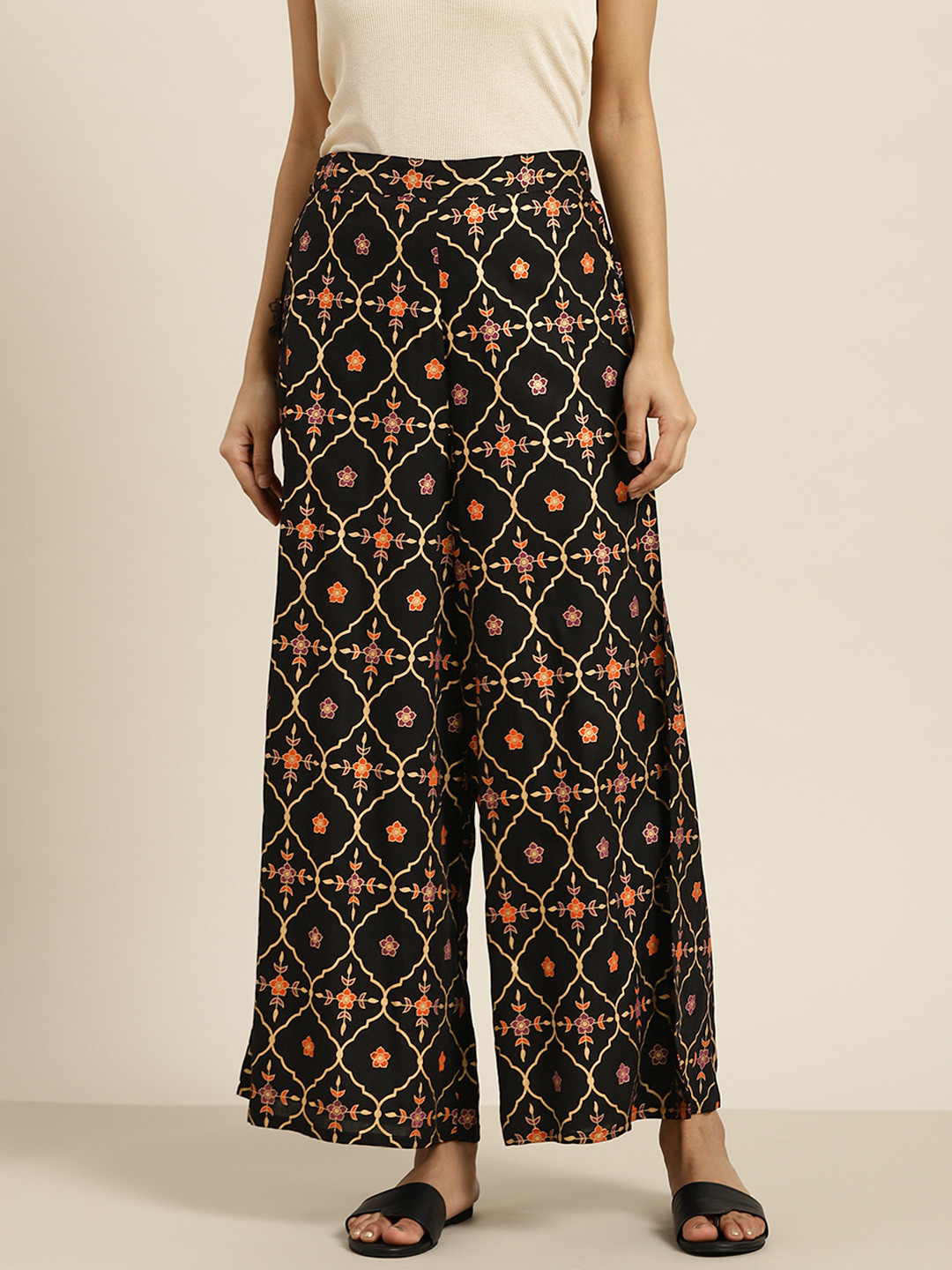 

Sangria Women Black & Golden Ethnic Motifs Print Wide Leg Palazzos