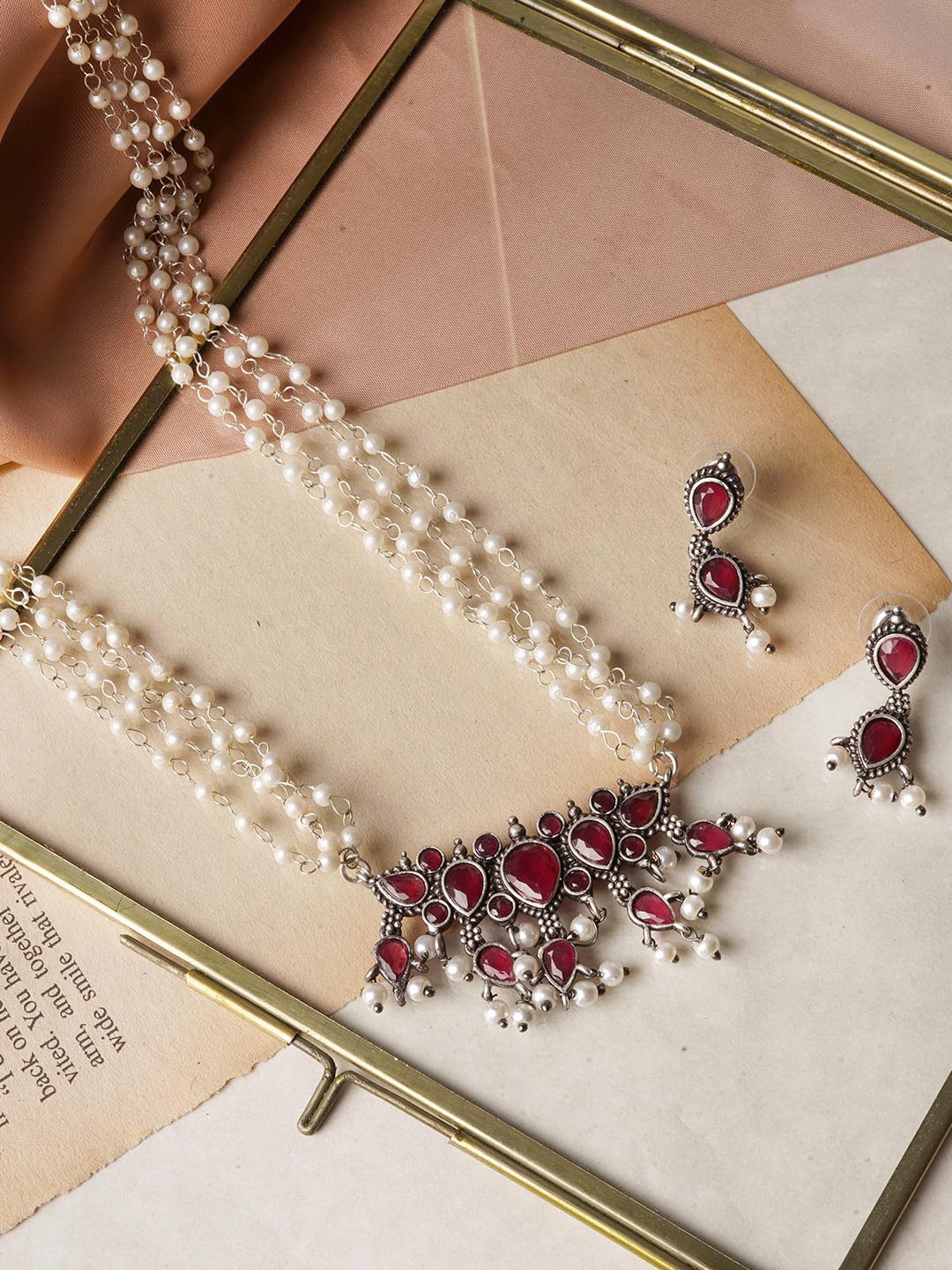 

Teejh White & Red Silver Toned Binita Stone Pearl Jewellery Set