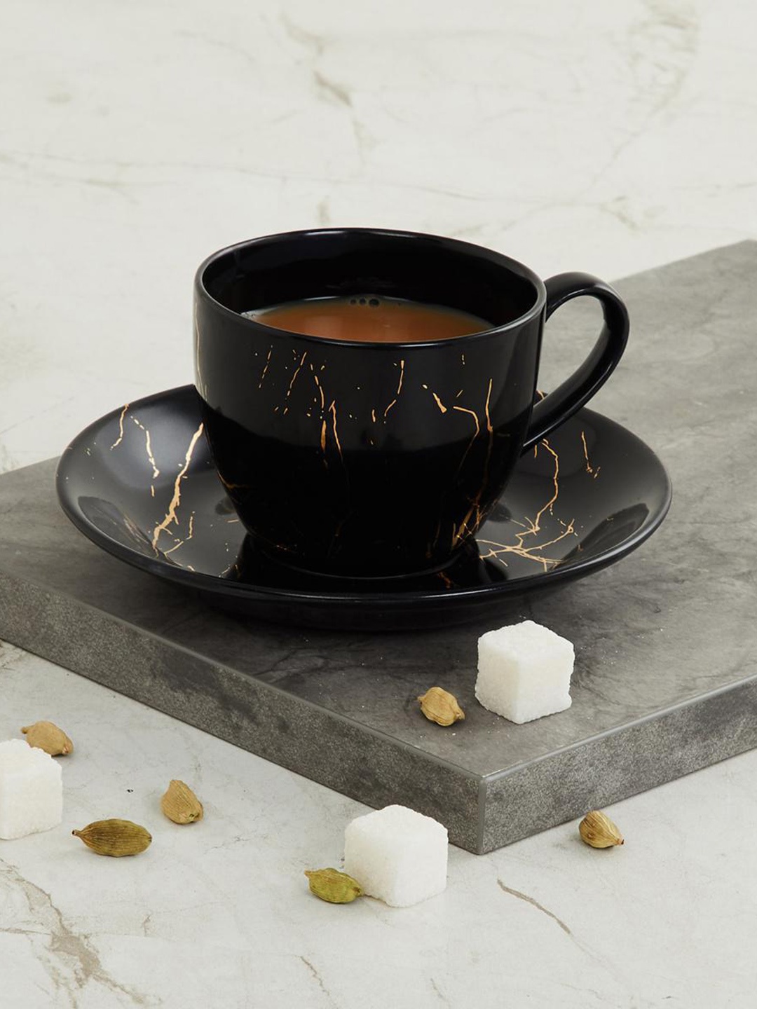 Home Centre Black Printed Marble Printed Cup and Saucer Set