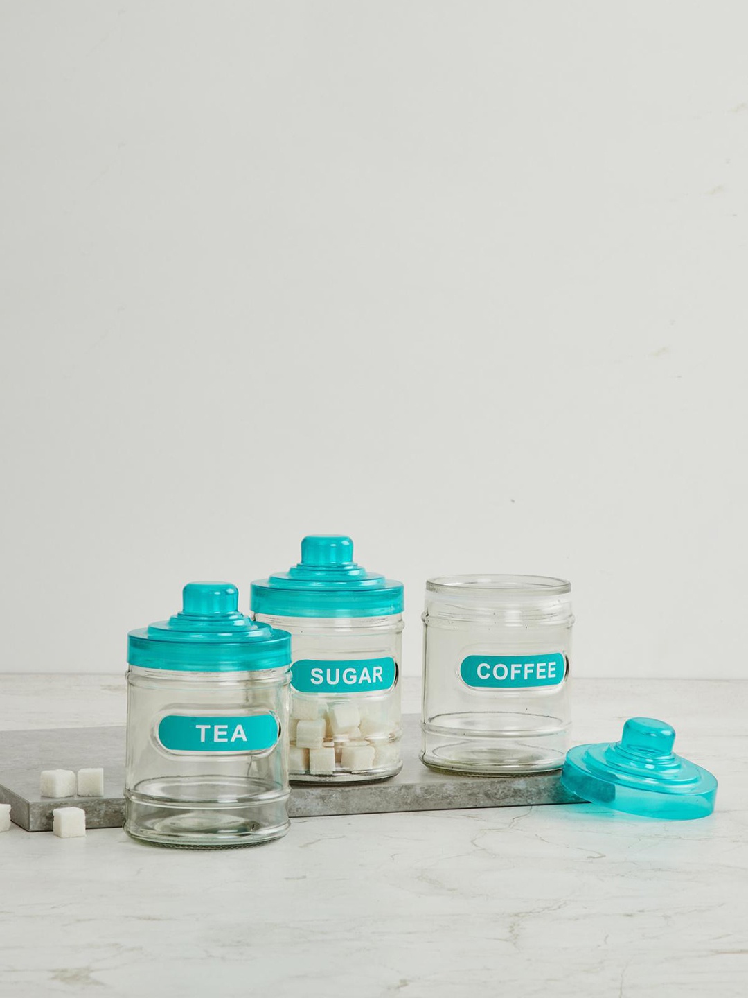 

Home Centre Set Of 3 Transparent & Blue Tuscany Solid Glass Storage Jars