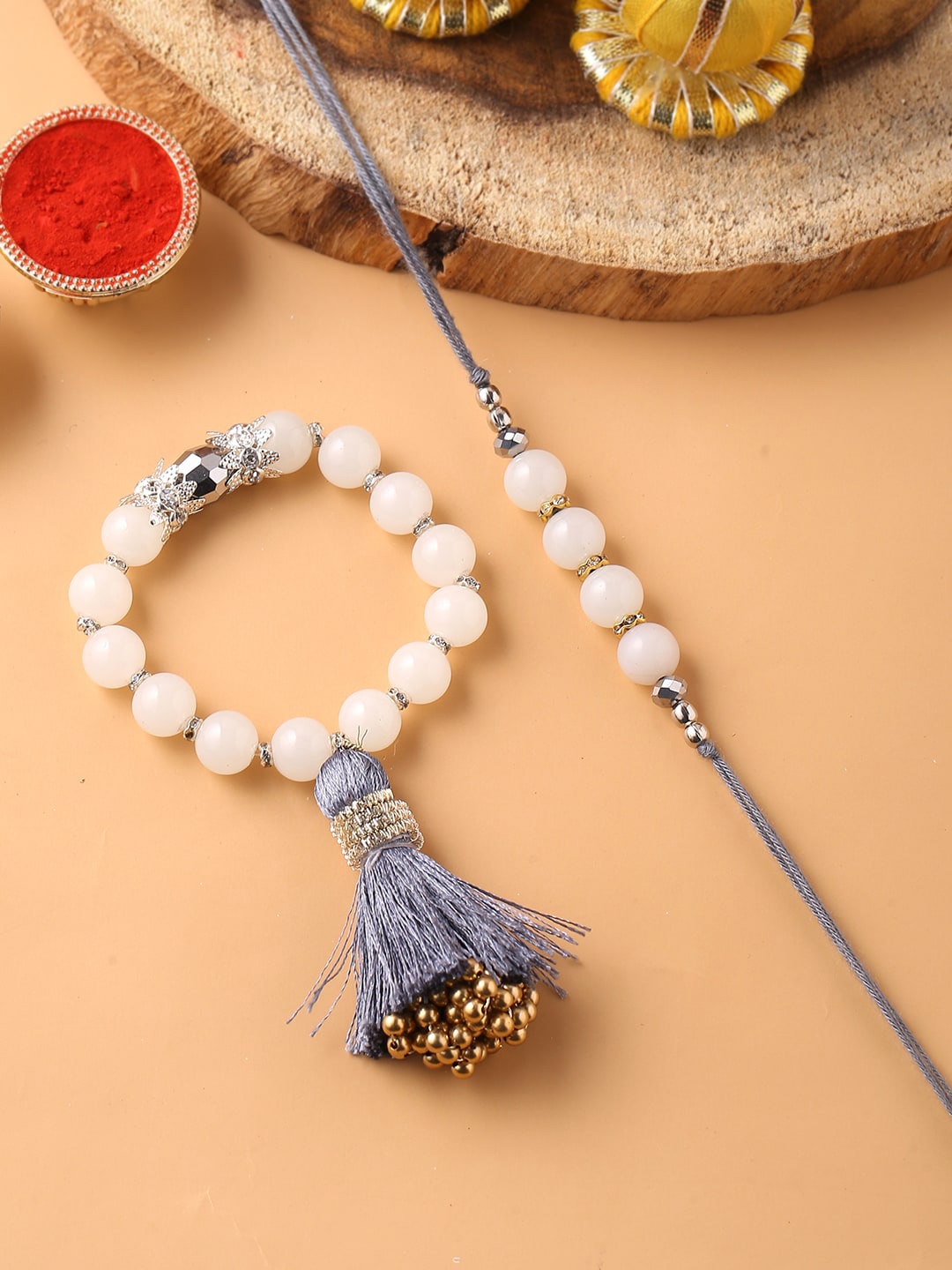

Voylla White Beaded Rakhi Combo With Roli Chaawal Pack
