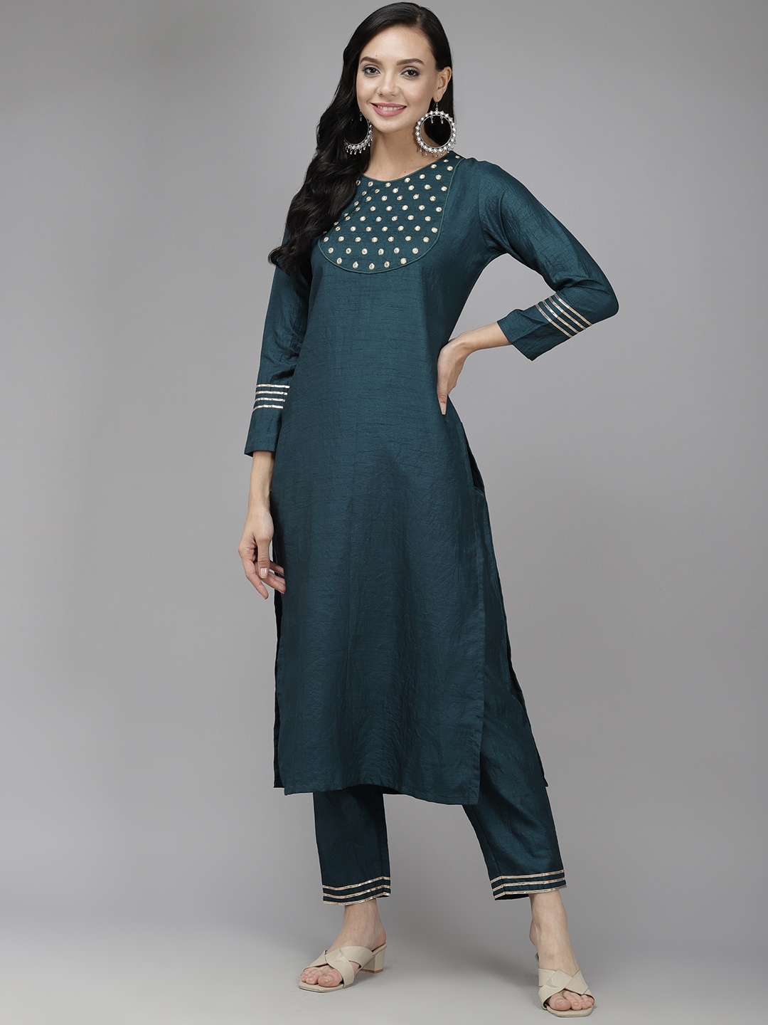 

Indo Era Women Teal Blue Yoke Design Regular Mirror Work Kurta with Palazzos