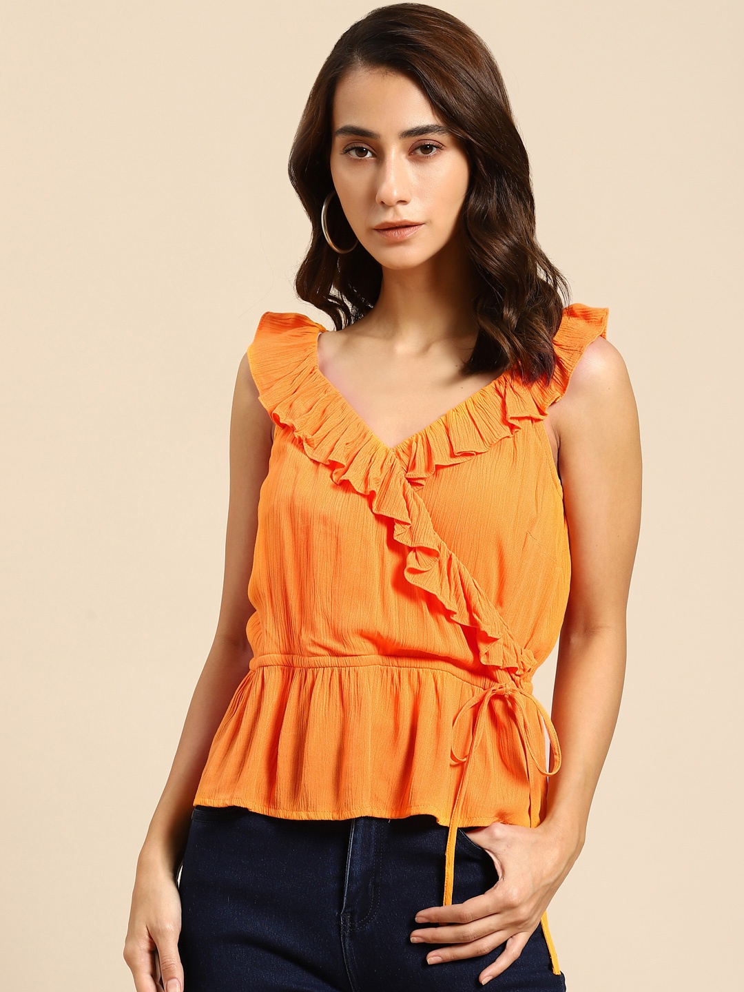 

COVER STORY Orange Ruffles Wrap Top