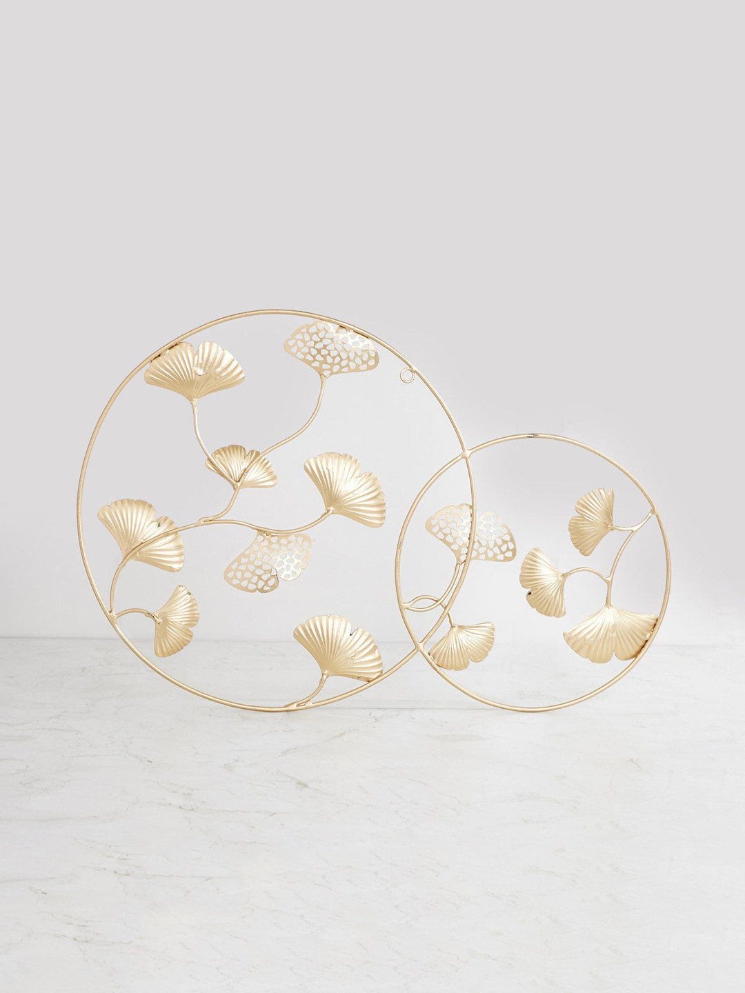

Home Centre Gold Toned Solid Samara Ginko Leaf Round Wall Art