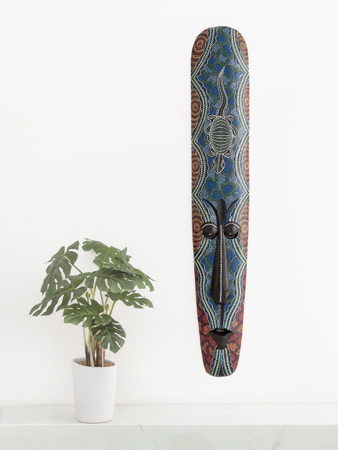 

Home Centre Blue & Black Printed Wooden Magnolia Mask