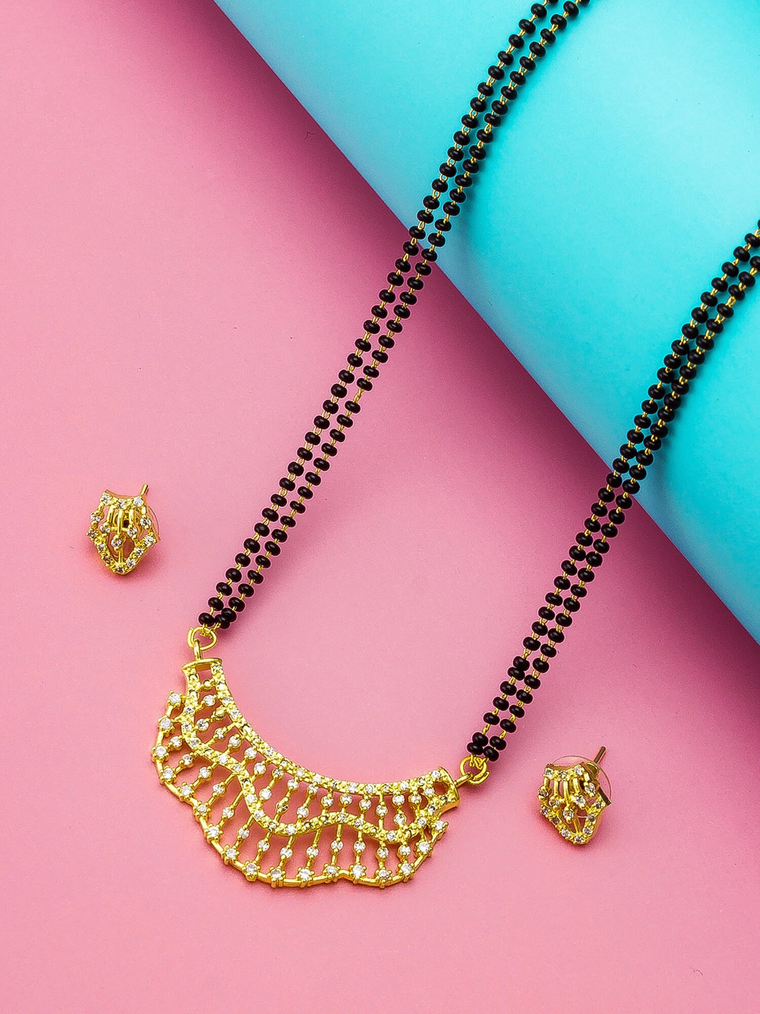 

aadita Gold-Plated Black & White AD-Studded & Beaded Mangalsutra With Earrings