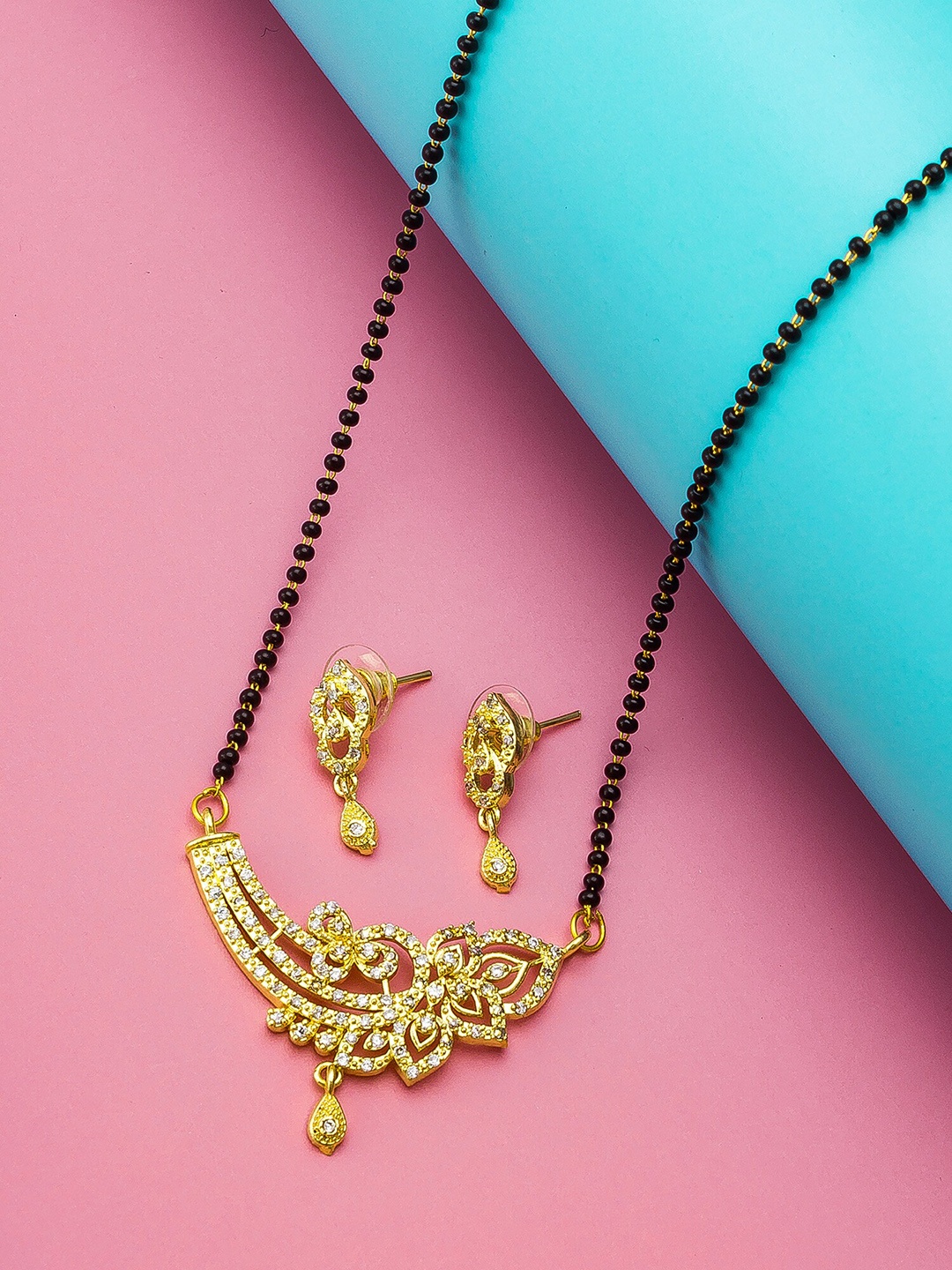 

aadita Gold-Plated Black & White AD-Studded & Beaded Mangalsutra With Earrings