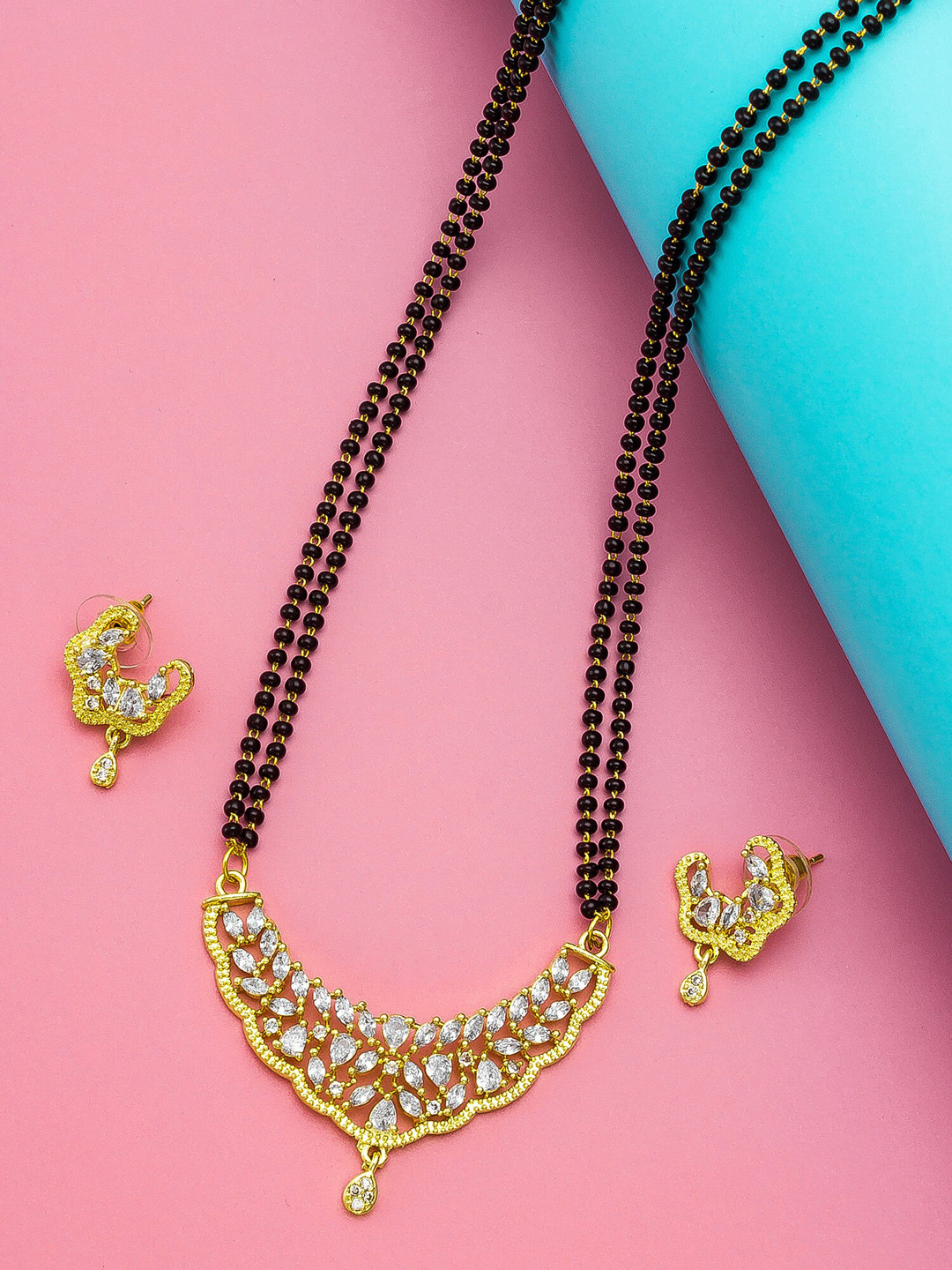

aadita Gold-Plated Black & White AD-Studded & Beaded Mangalsutra With Earrings