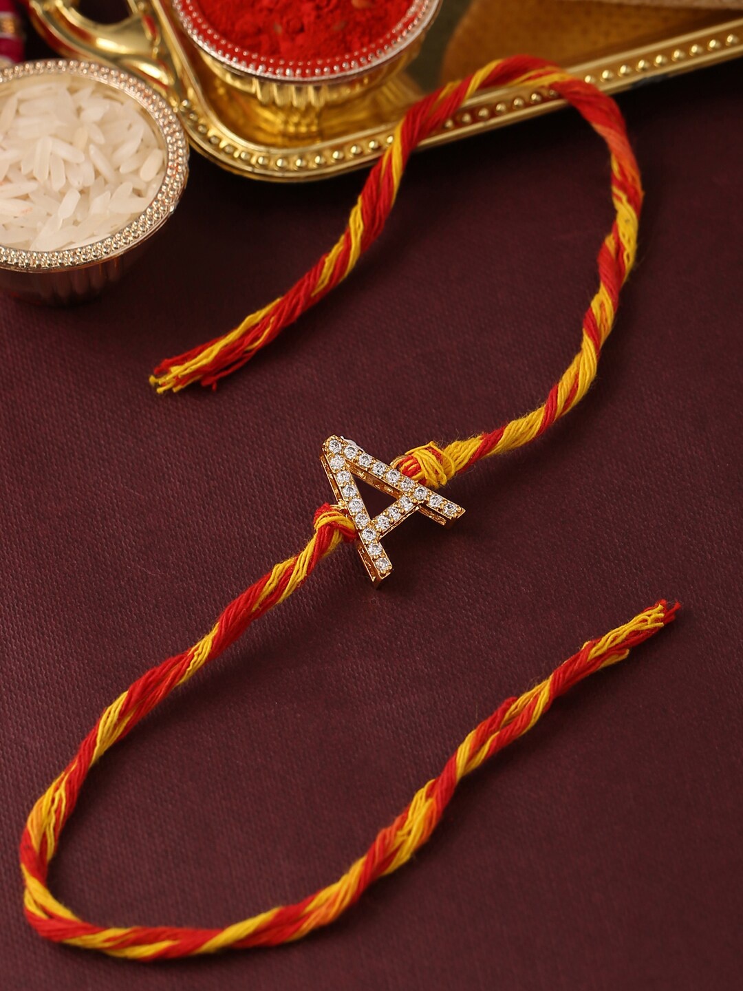 

Tistabene Men Gold-Toned Red& White AD-Studded A Alphabet Rakhi