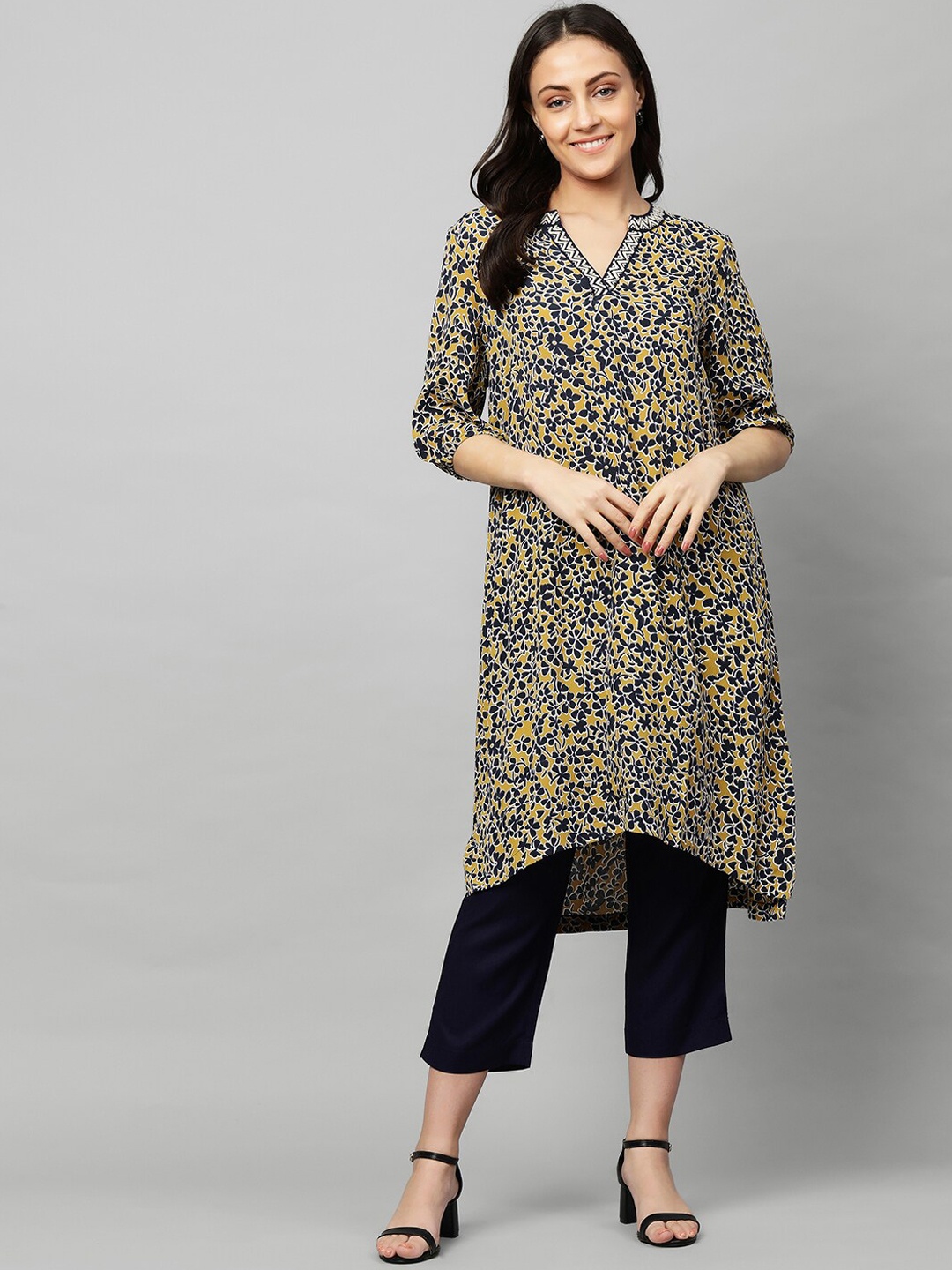 

Modern Indian by CHEMISTRY Women Yellow Floral Printed Regular Kurta with Black Trousers