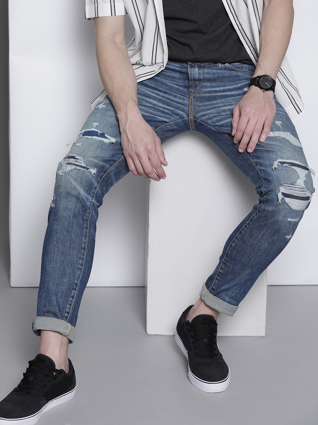 

AMERICAN EAGLE OUTFITTERS Men Navy Blue Skinny Fit Mildly Distressed Light Fade Stretchable Jeans