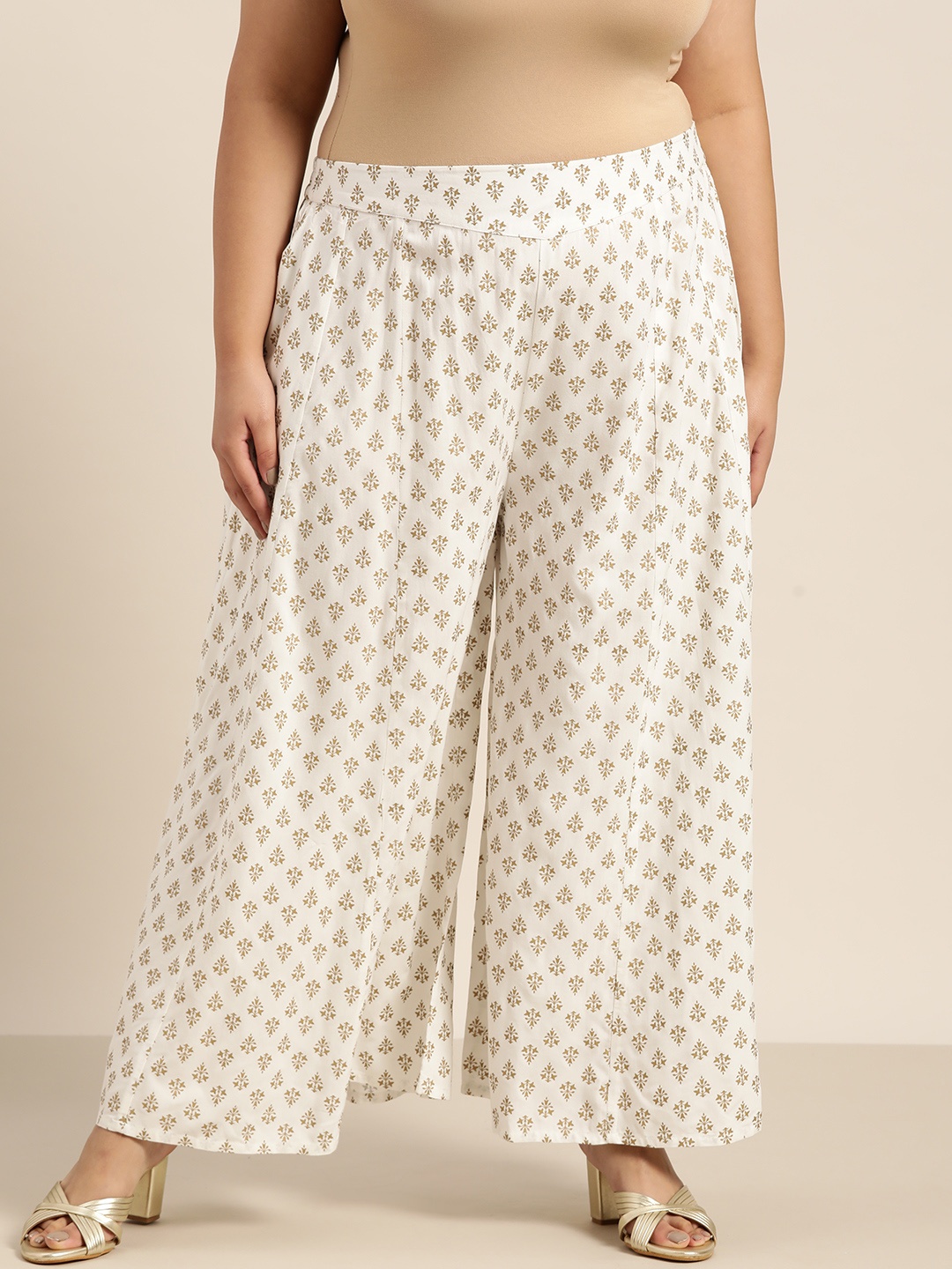 

Juniper Plus Women Off White & Gold-Toned Ethnic Motifs Printed Flared Liva Ethnic Palazzos