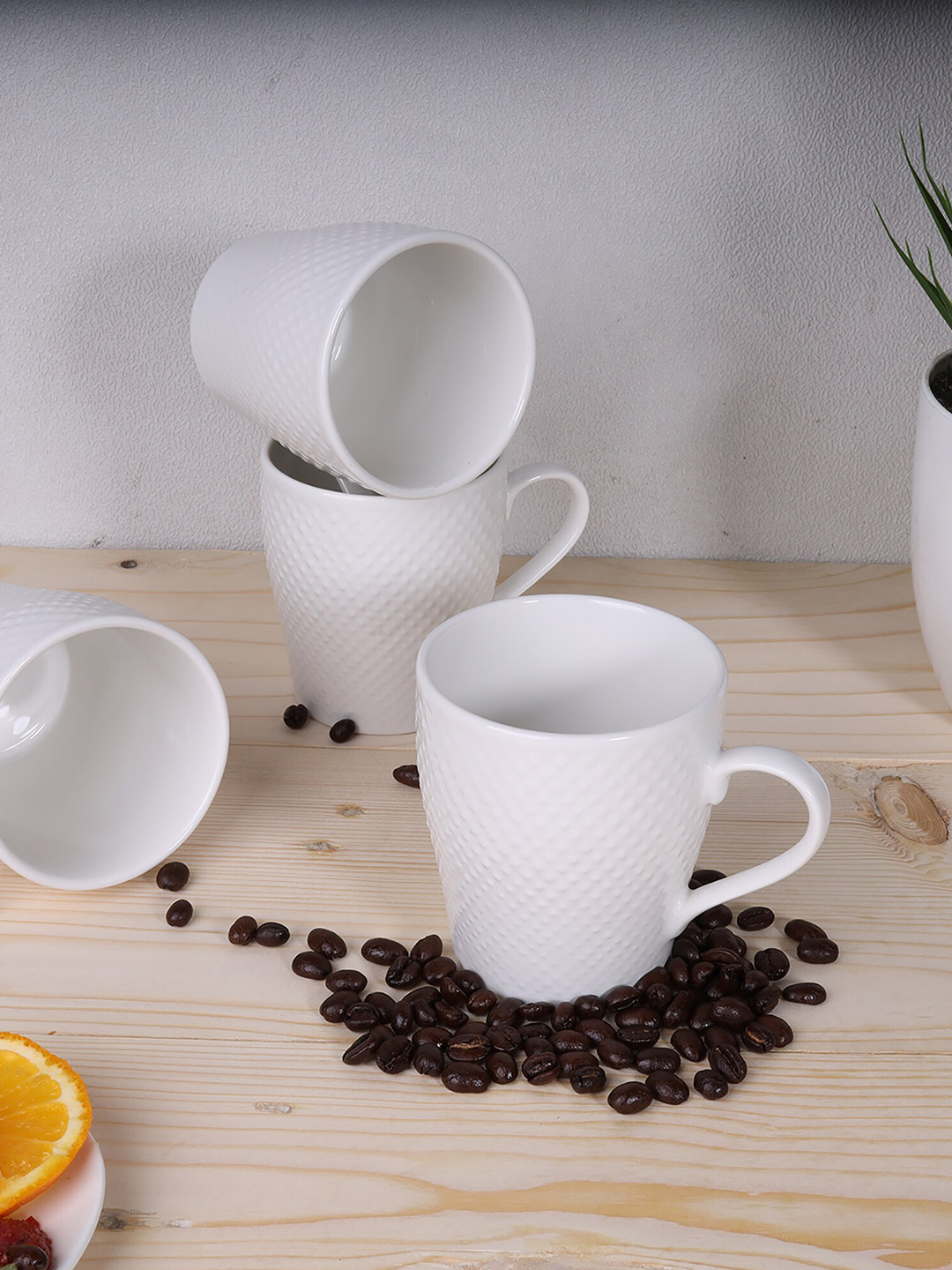 

Ariane Set Of 4 White Handcrafted Textured Porcelain Glossy Dotted Cups