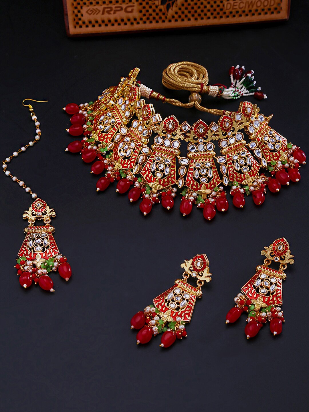 

Yellow Chimes Gold-Plated White & Red Kundan-Studded & Beaded Handcrafted Meenakari Jewellery Set