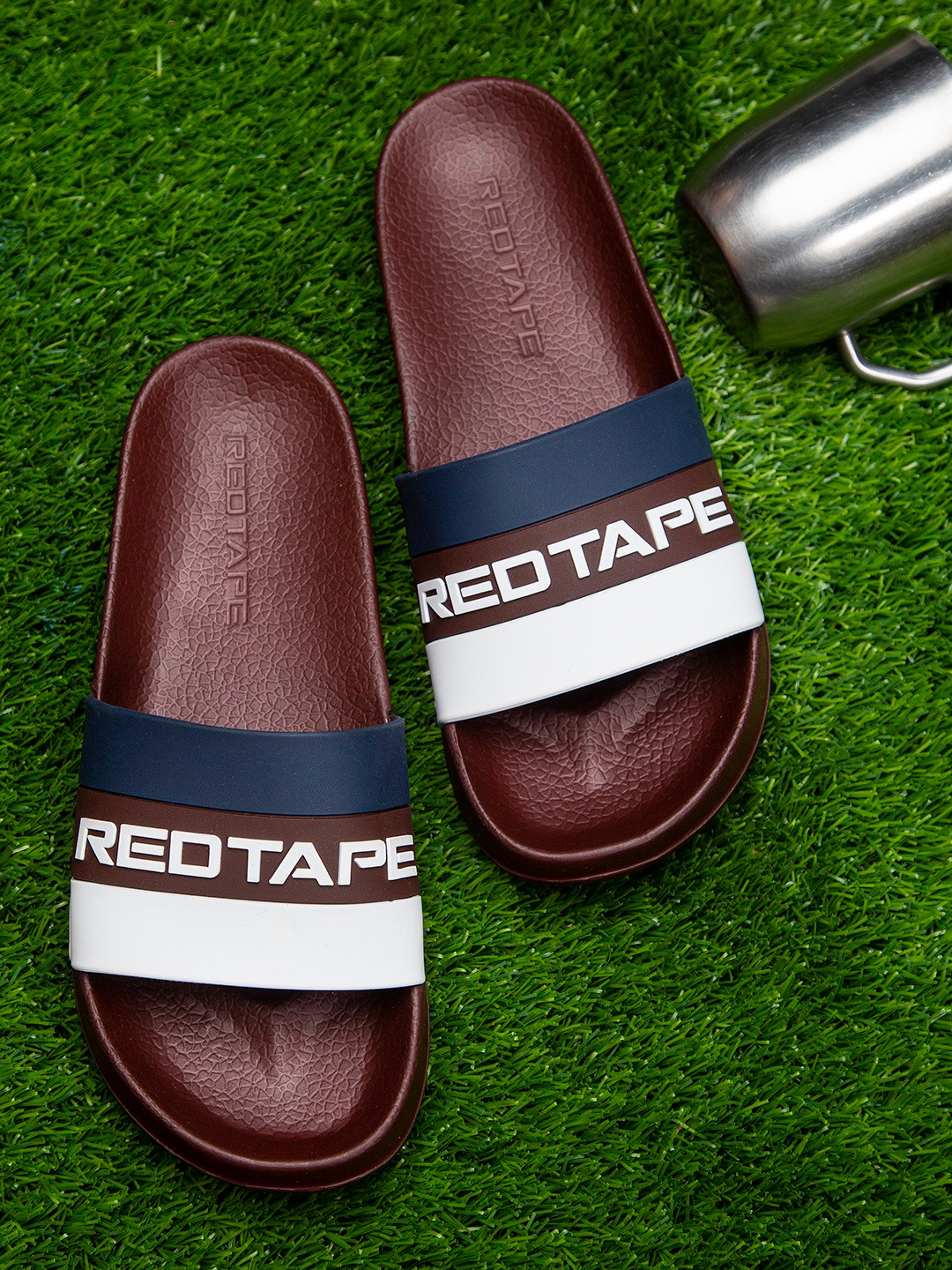 

Red Tape Men Maroon & White Printed Rubber Sliders