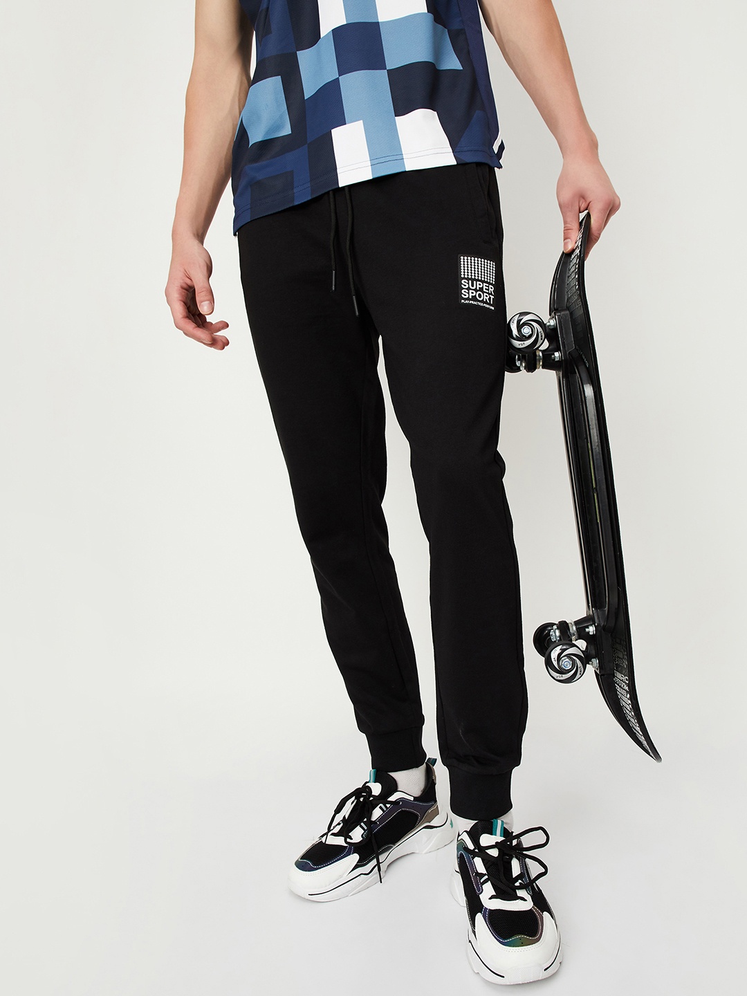 

max Men Black Solid Joggers