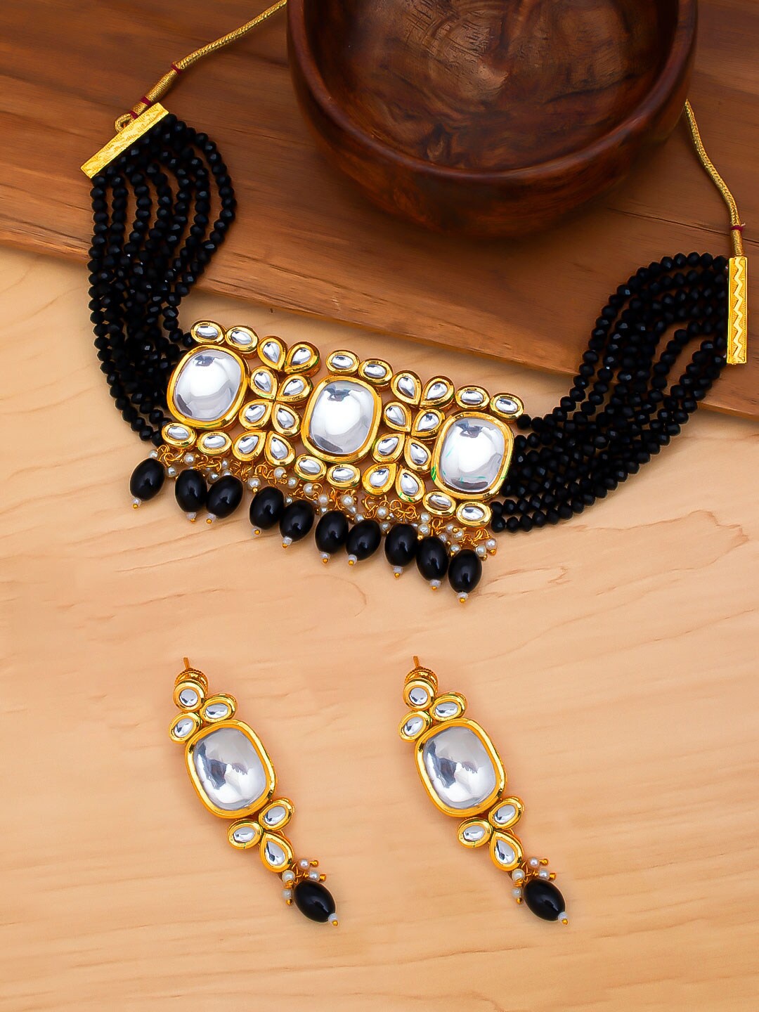 

Sukkhi Gold-Plated Black & White Kundan-Studded & Pearl Beaded Jewellery Set
