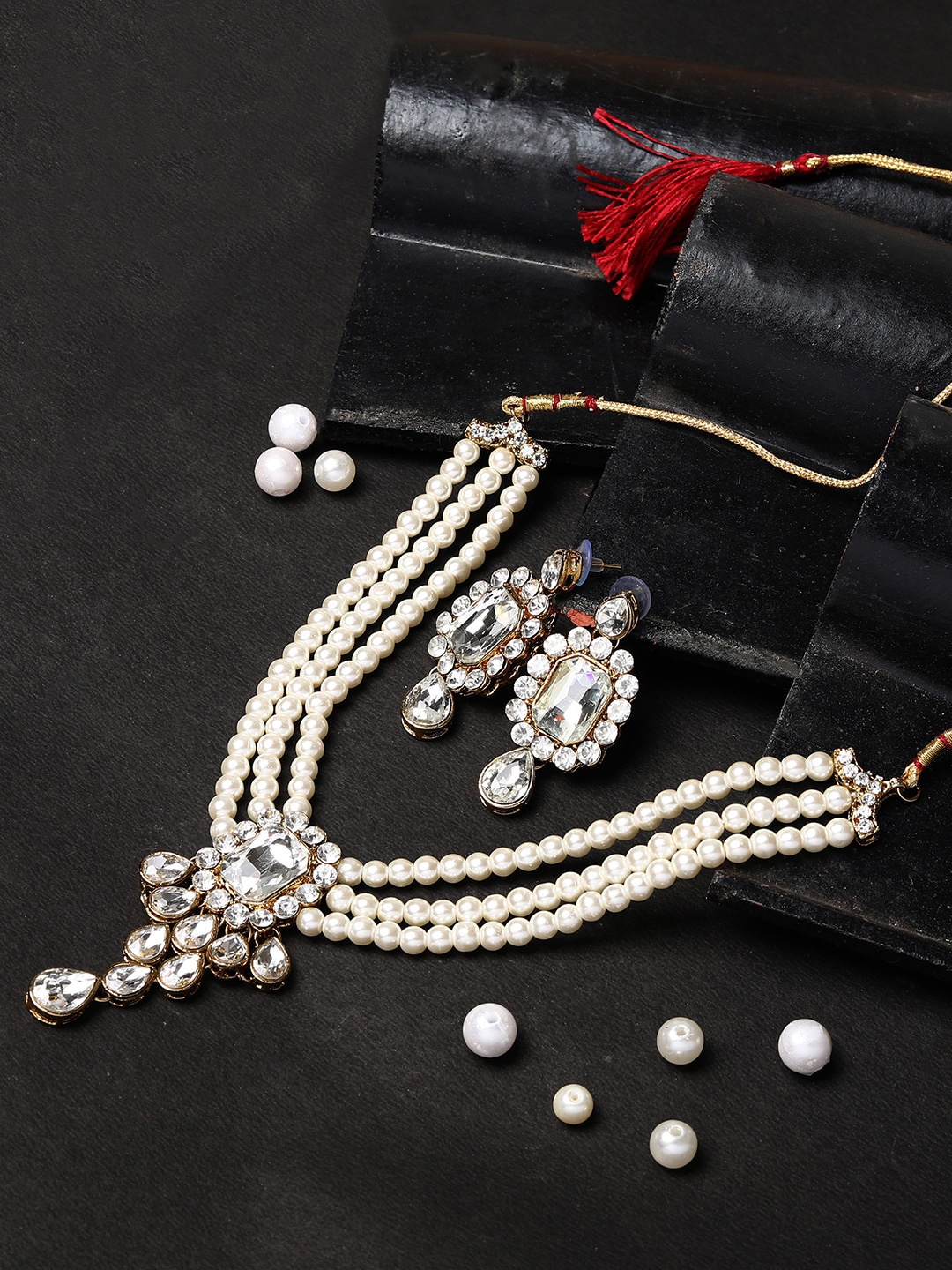 

ANIKAS CREATION Gold-Plated White Stone Studded & Beaded Jewellery Set