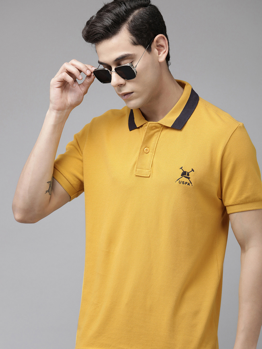 

U.S. Polo Assn. Men Yellow Solid Polo Collar Pure Cotton Slim Fit T-shirt