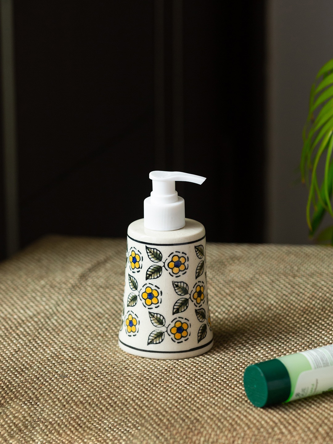 

ExclusiveLane White Yellow Floral Printed Handpainted Ceramic Liquid Soap Dispenser