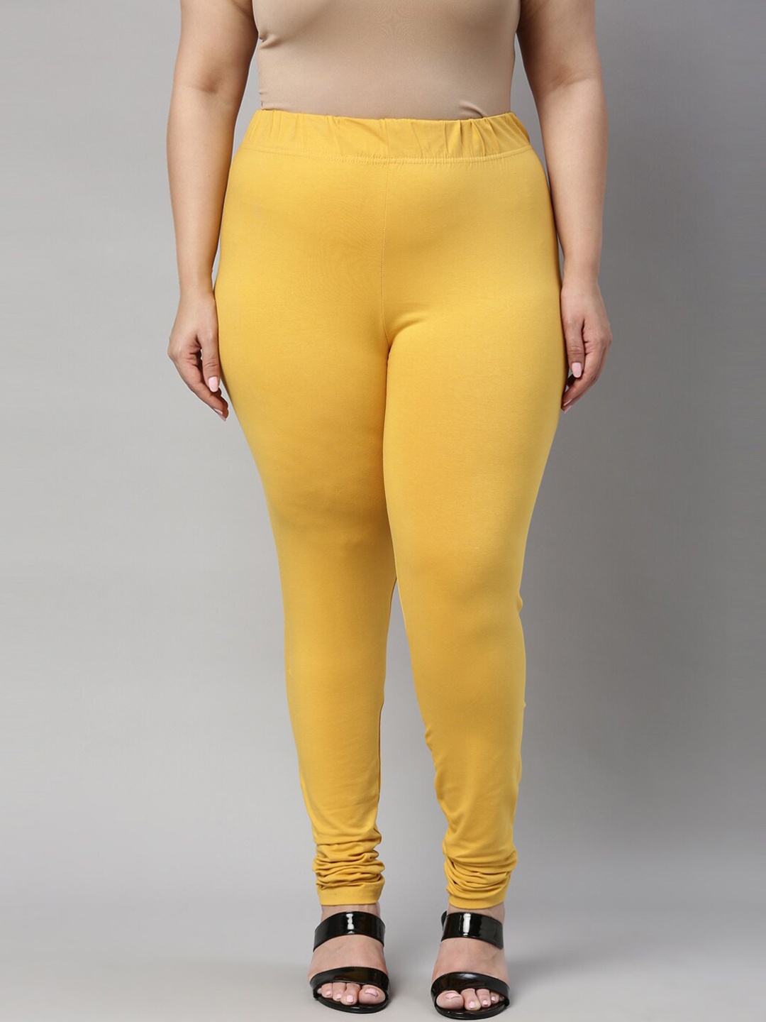 

Go Colors Women Yellow Solid Cotton Churidar-Length Leggings
