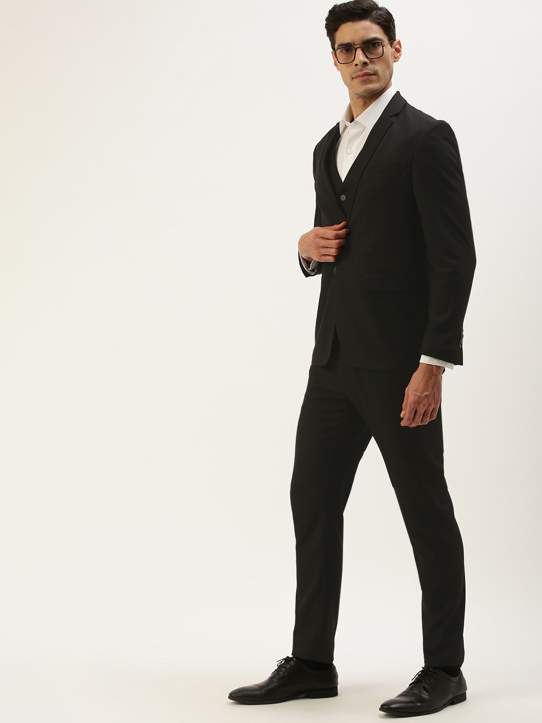 

Peter England Men Solid Black Three Piece Suit