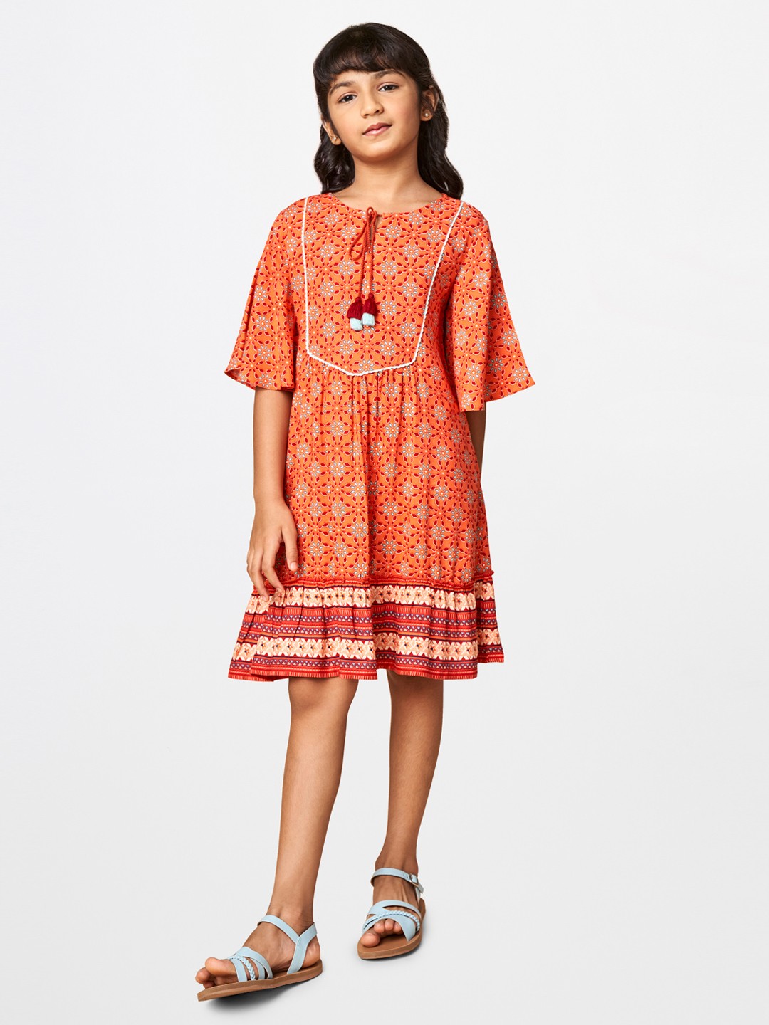

Global Desi Girls Orange Ethnic Motifs Tie-Up Neck A-Line Dress