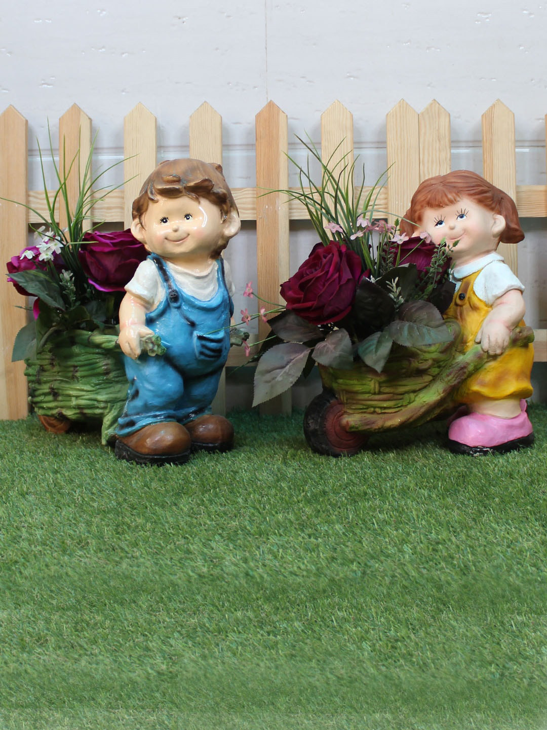 

Wonderland Set Of 2 Boy & Girl Pushing Trolley Planters, Blue